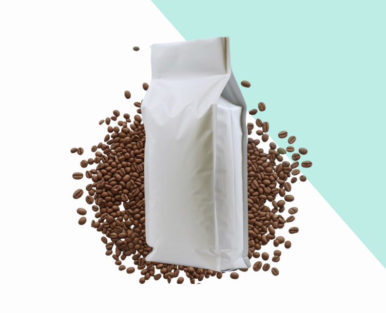 White coffee bag surrounded by scattered coffee beans on a two-tone background of white and light blue.