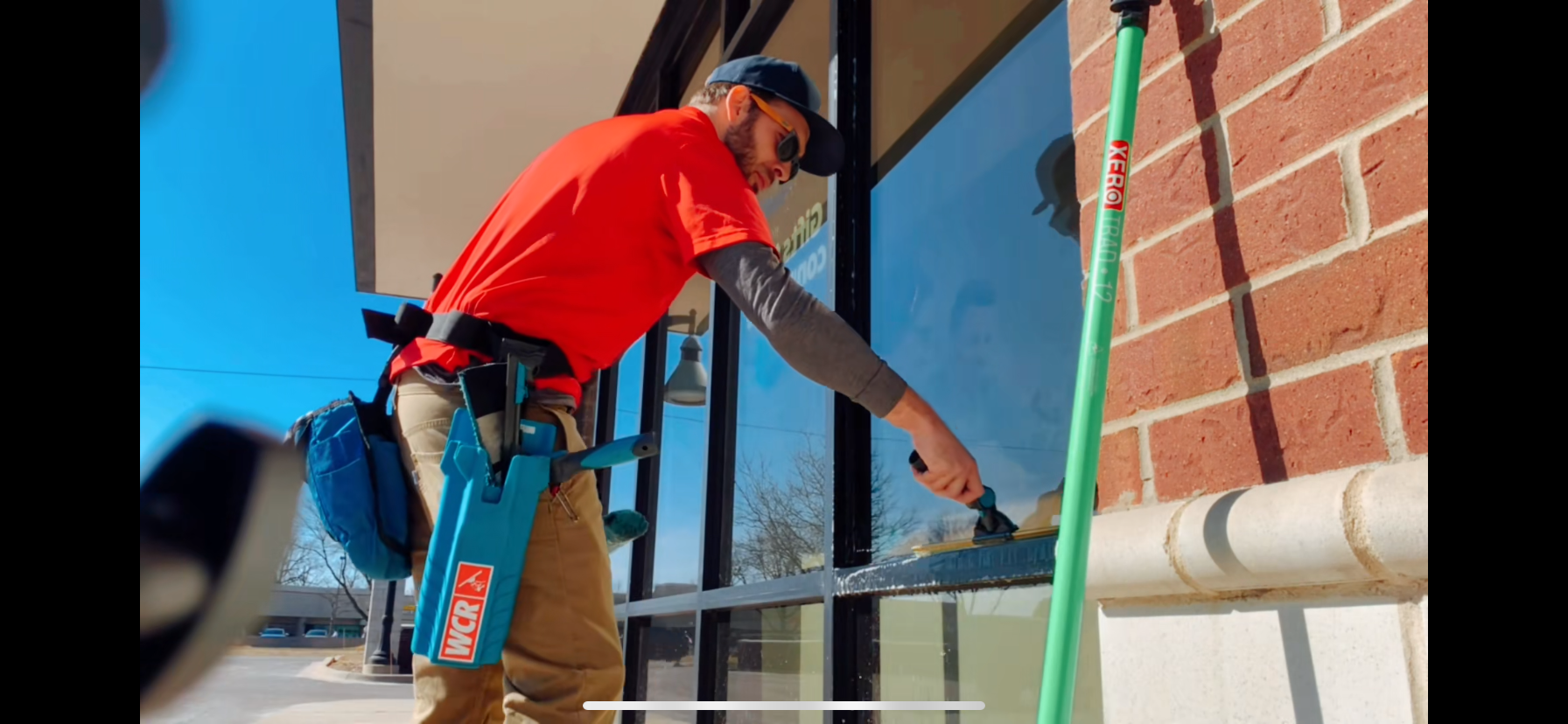 Professional window cleaning with squeegee