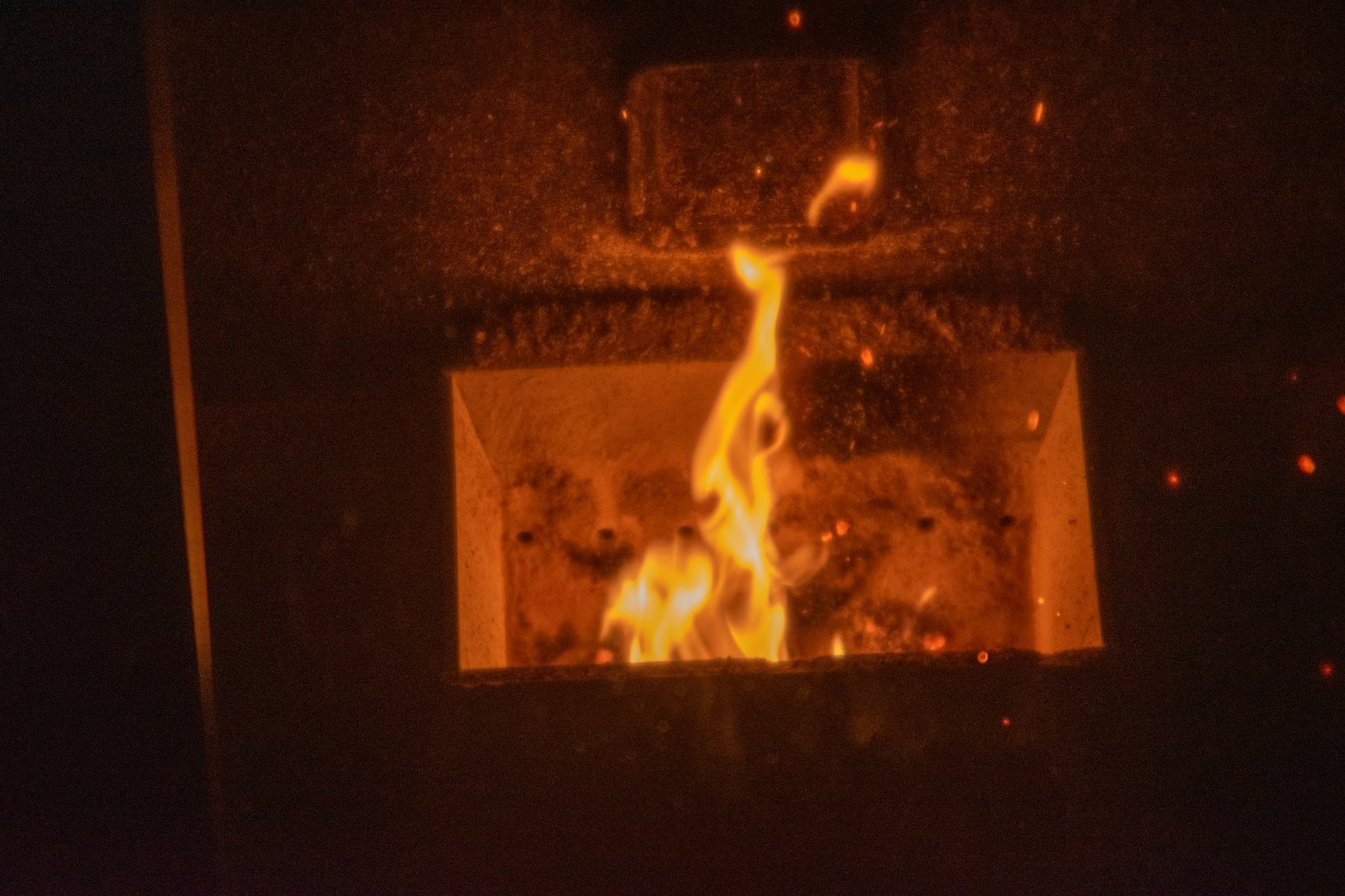 Burning fire from pellet wood furnace.