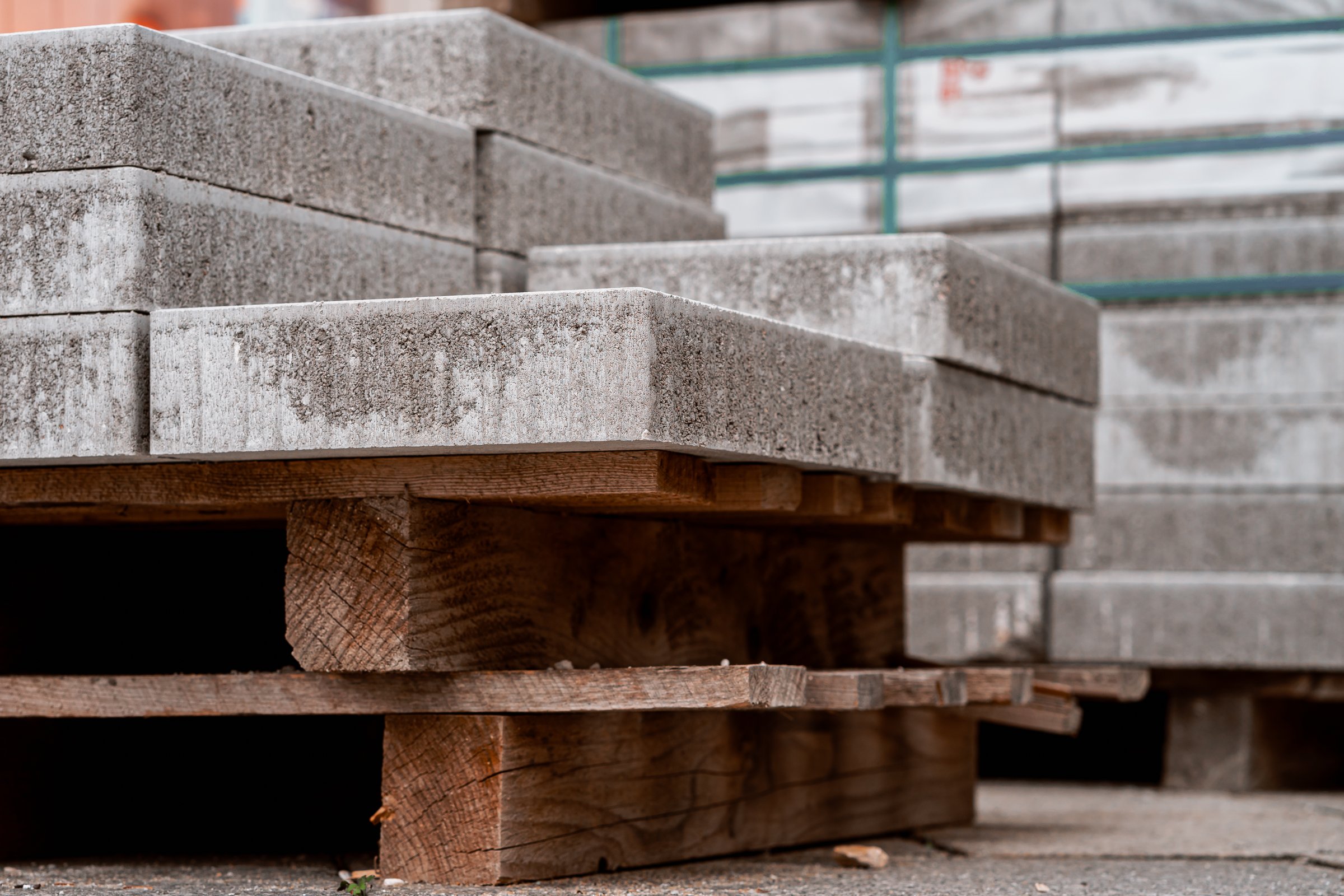 Stone slabs for road repairs stacked on a wooden pallet.