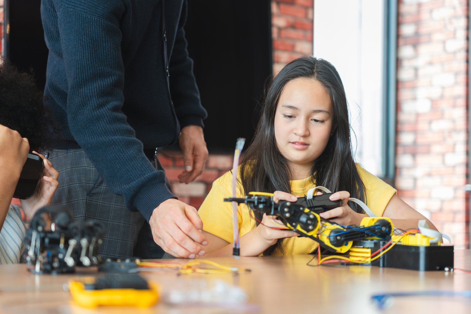 Young Students Exploring Technology with Robotics and Virtual Reality, STEM Education Diverse Girls Learning About Engineering and Innovation, Teacher Guiding Girls in Robotics and VR Class