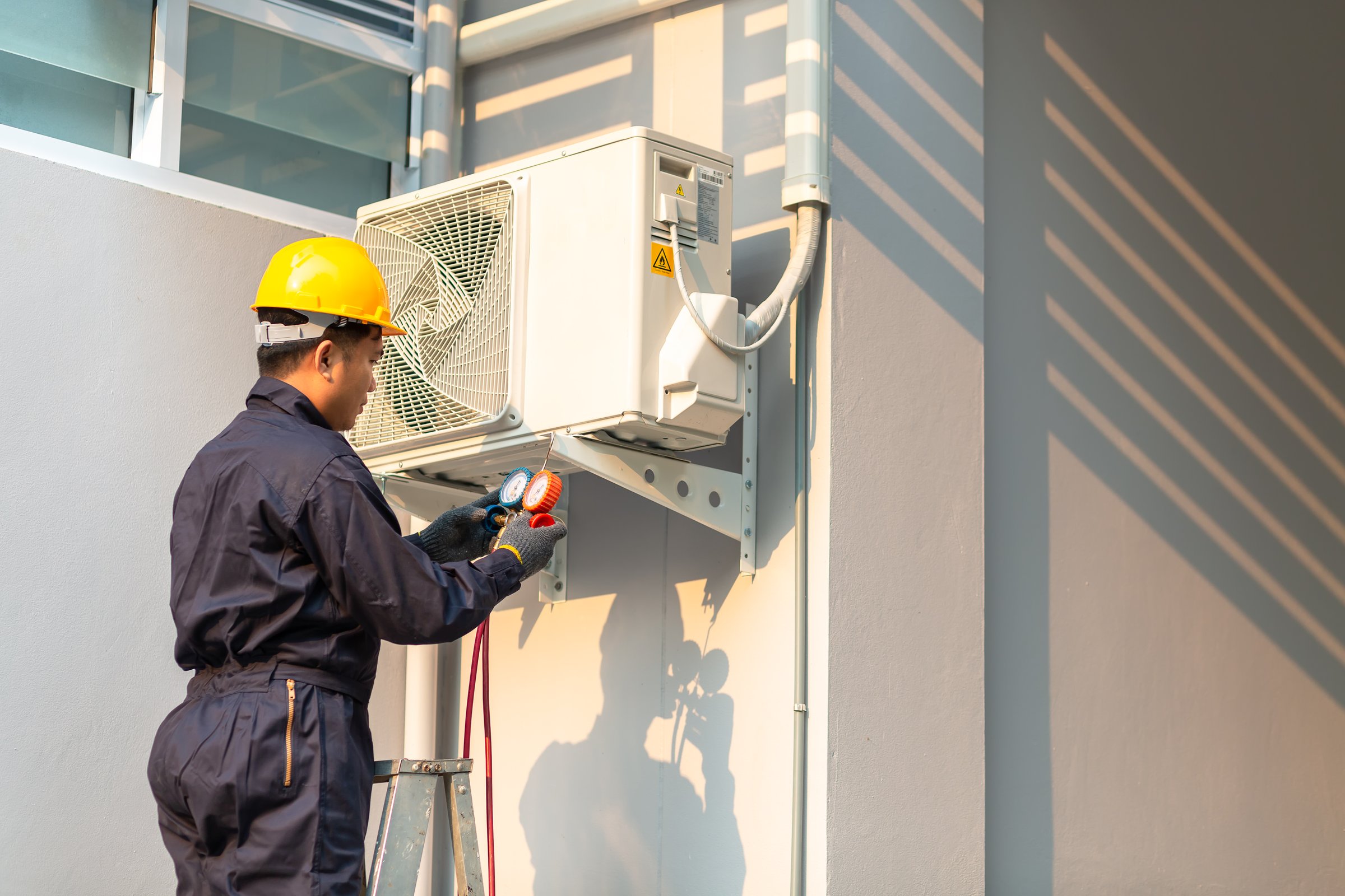 Technician Repairing Air Conditioner