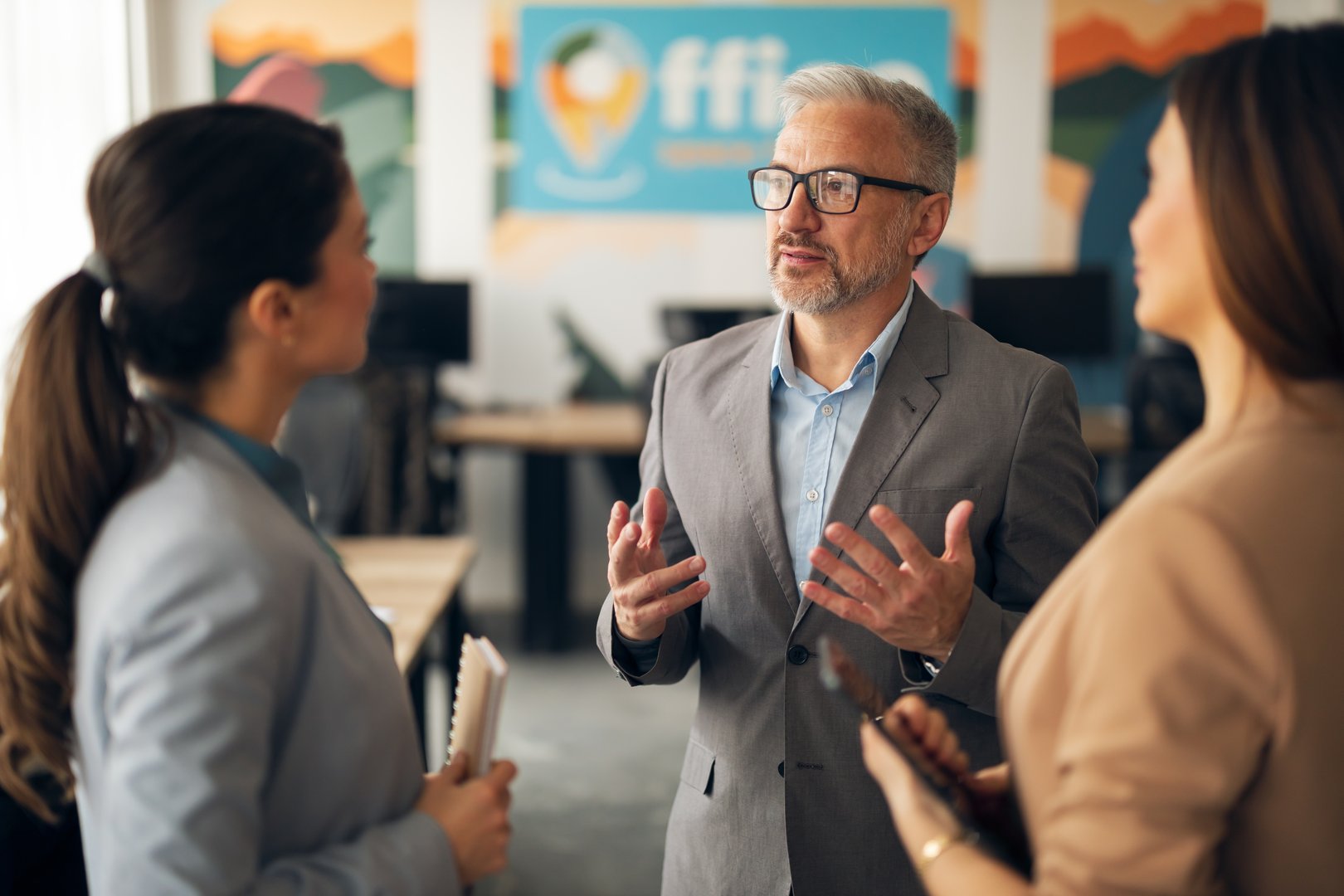 A team of professionals in a meeting discussing ideas and projects in a contemporary office environment, fostering collaboration and strategy development. The scene emphasizes teamwork and professional communication.