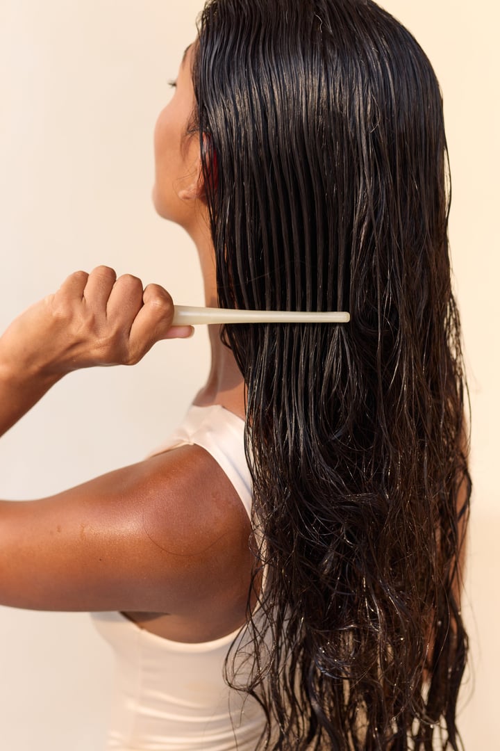 Woman Combing Long Wet Hair, Showcasing Smoothness And Care. Elegant Routine Of Natural Beauty, Highlighting Health And Shine. Invokes Feelings Of Relaxation, Self-care, And Hair Nourishment.