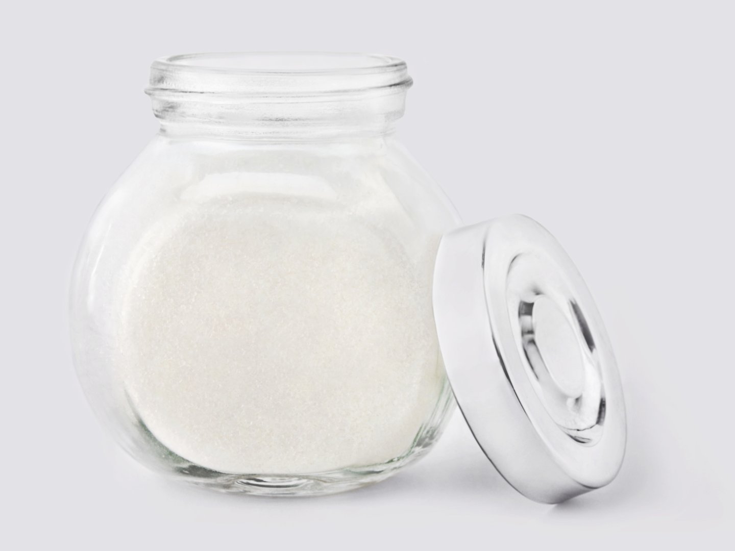 White sugar and glass close up