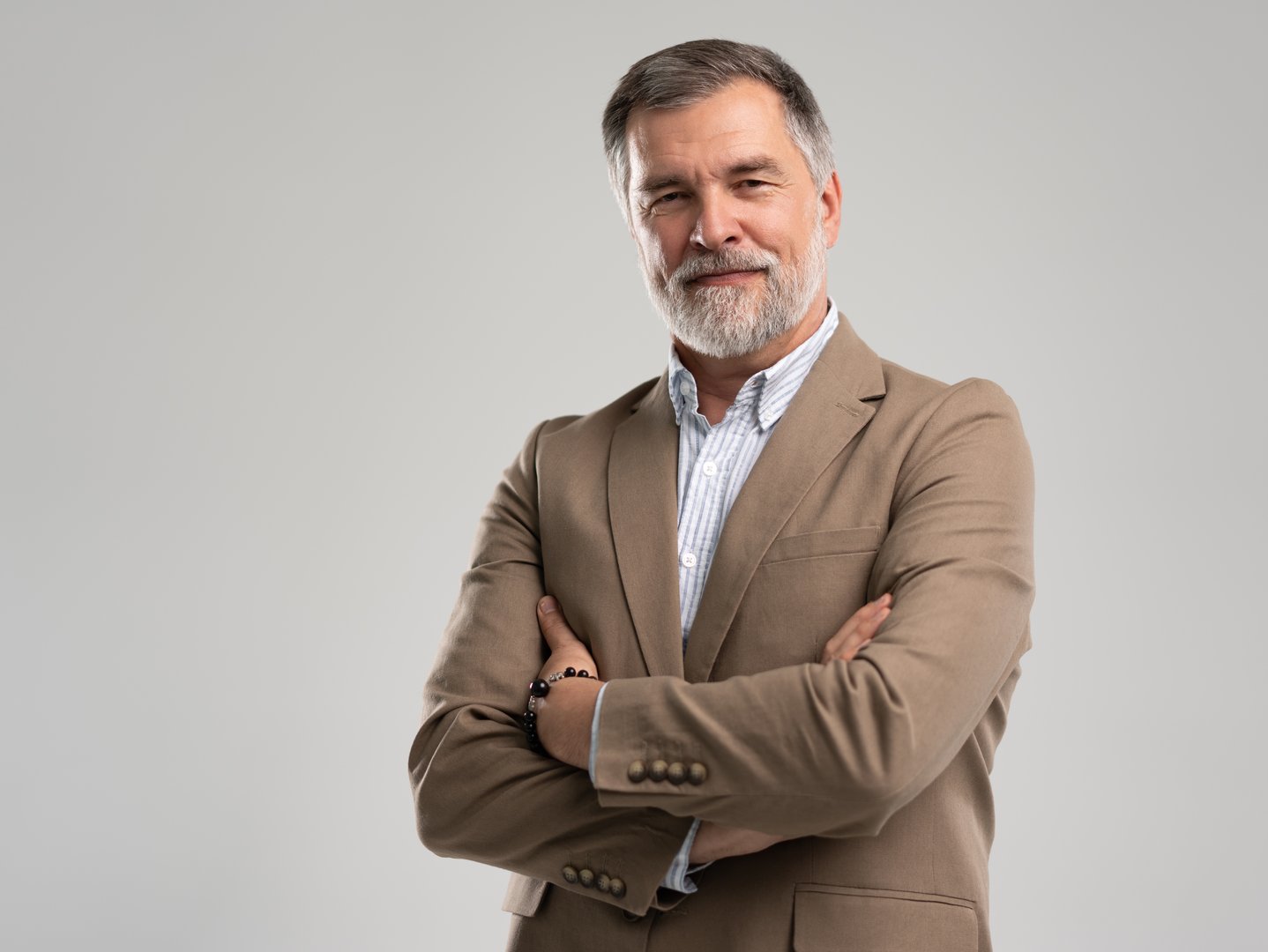 Business portrait of confident businessman. Entrepreneur in jacket smiling, Happy mid adult, mature age man standing, smiling, isolated on white background.