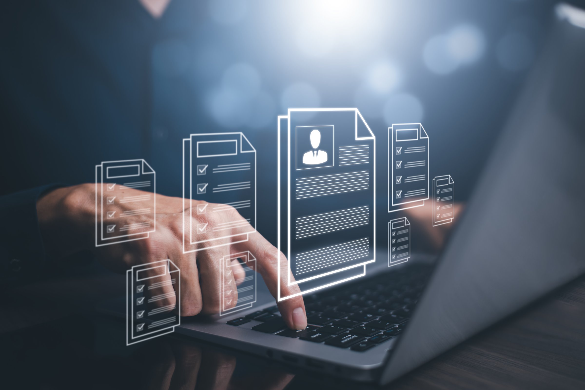 businessman using laptop with  Personal information file storage concept ,HR checklists of employees Corporate data management system and document management system with employee privacy.