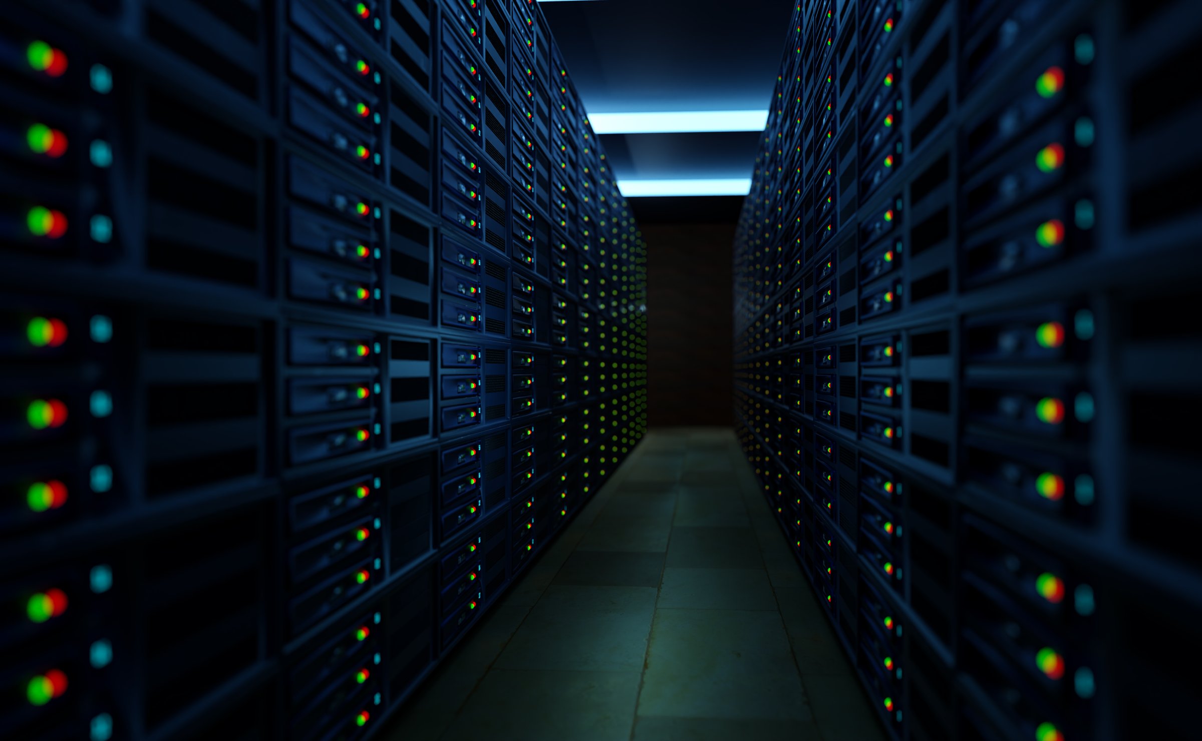 View into a server room. Computers are lined up in a room with subdued lighting. Technology, data storage, hard drives, IT service, cloud computing. 3D illustration