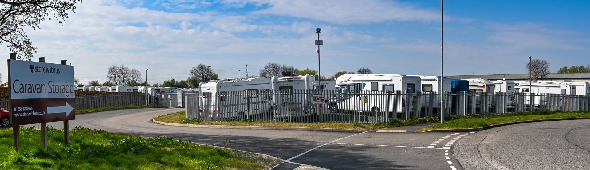 Bridgend, Wales - April 2021: Entrance to a storage yard for caravans and camper vans on an industrial estate in Bridgend