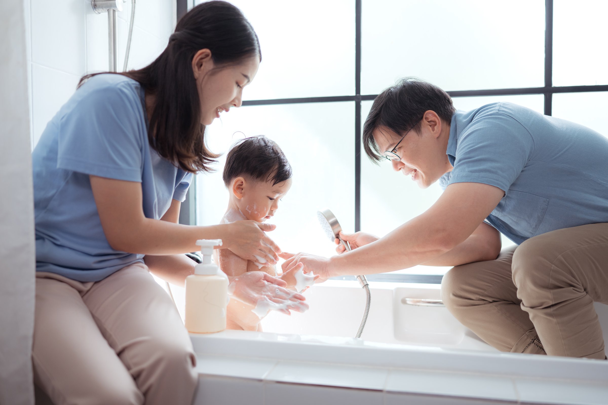 Happy time for bath, Asian kid and parents enjoying bath in the bathroom
