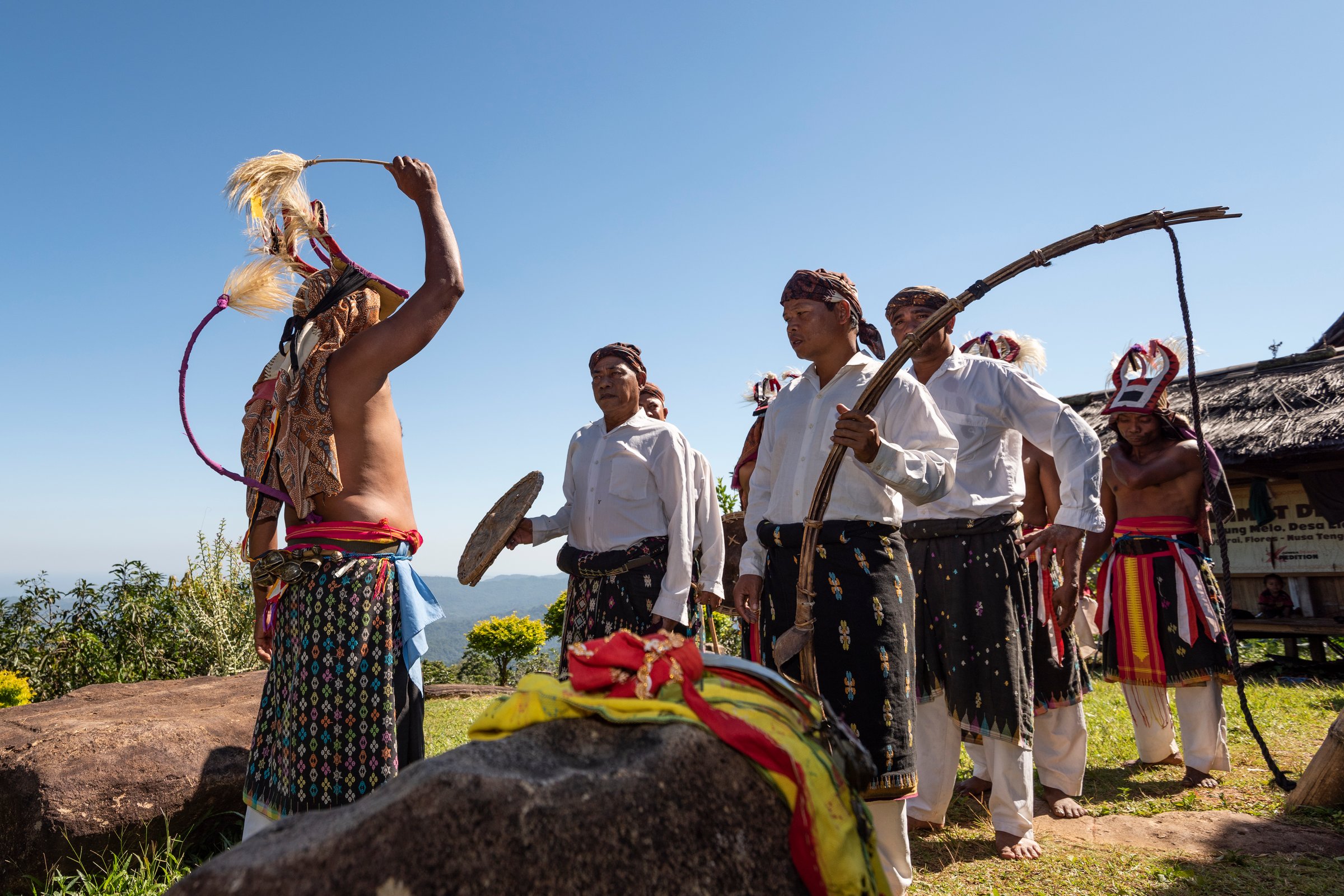 Flores Island, Indonesia: An elder sharing traditional cultural knowledge with a young child, highlighting intergenerational learning