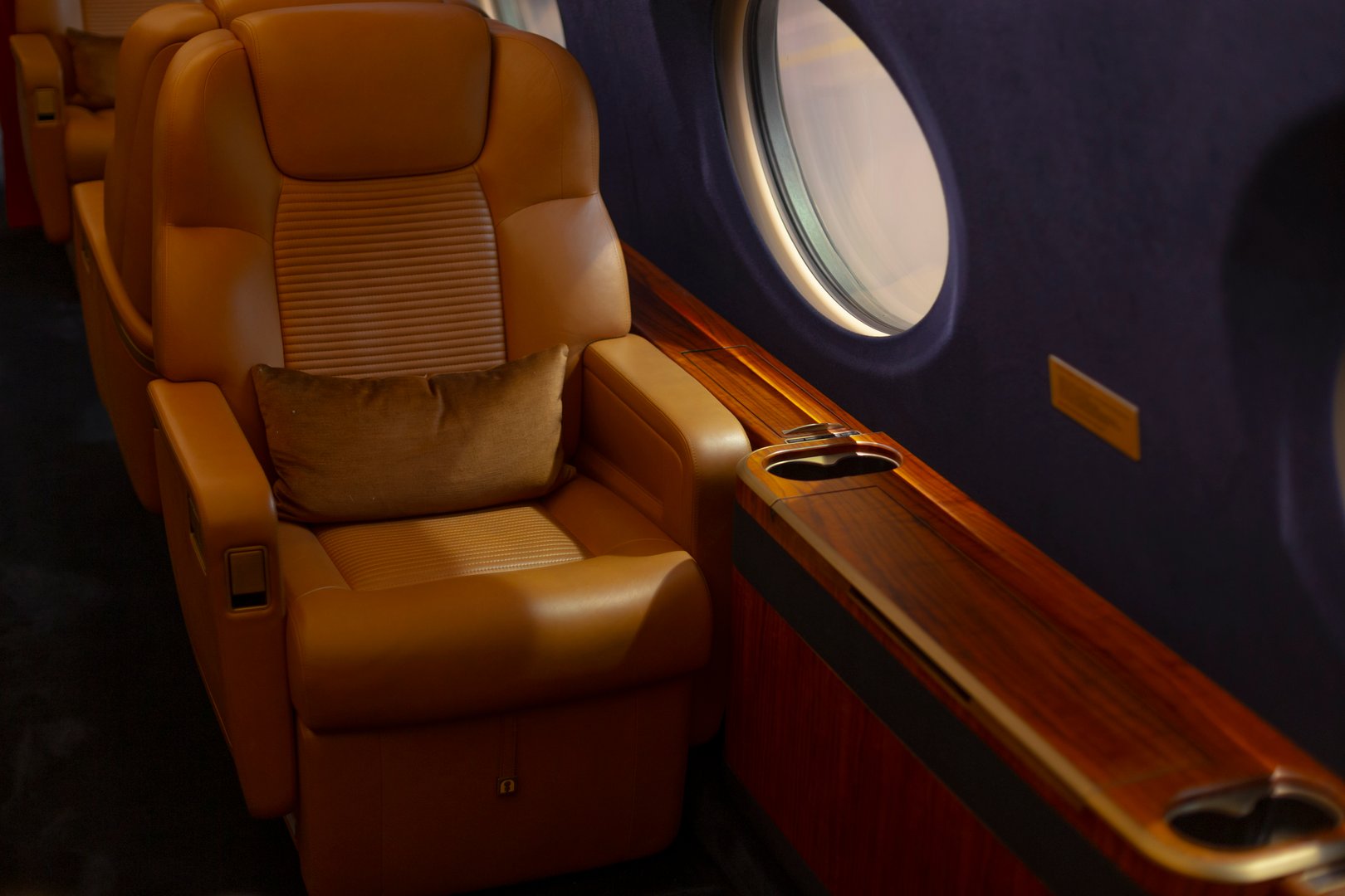 Opulent aircraft interior. Exclusive leather cabin features. Luxurious Gulfstream seat with lighting and comfort.