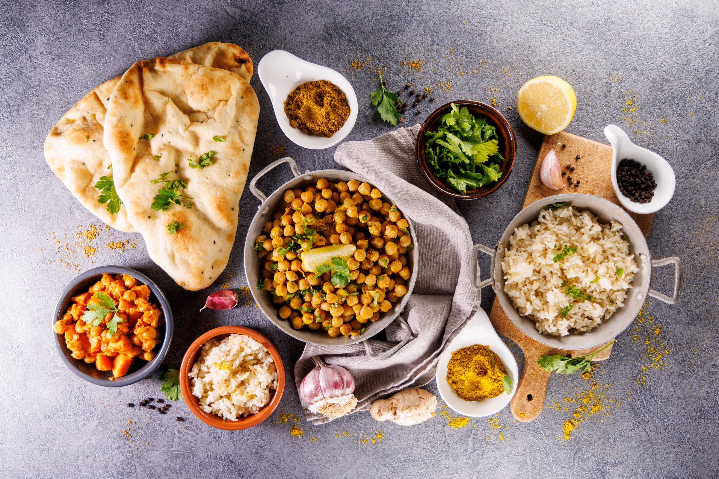 indian naan bread, chickpea curry, rice and spices
