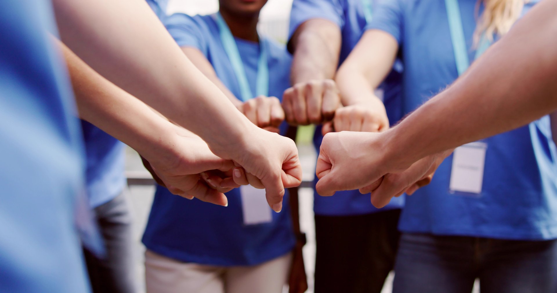 Volunteer Charity Team Joining Hands Together. Teamwork Concept