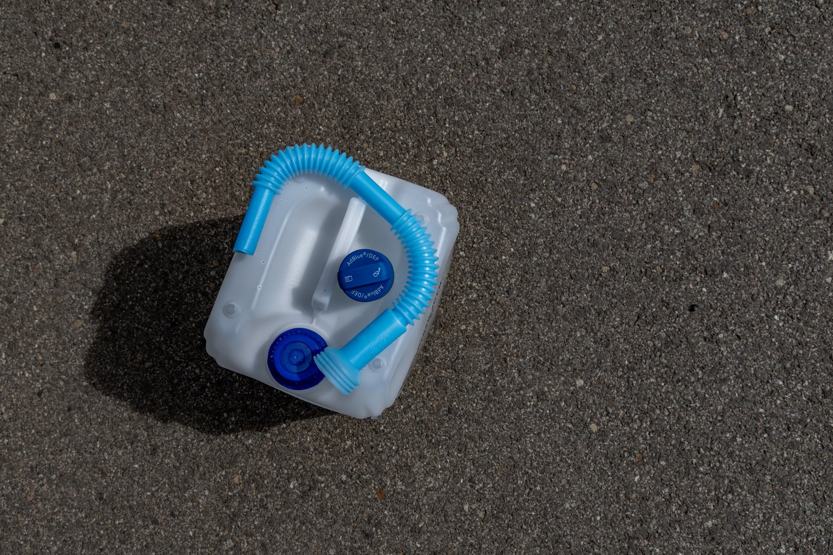 Adblue water fuel canister with funnel in car