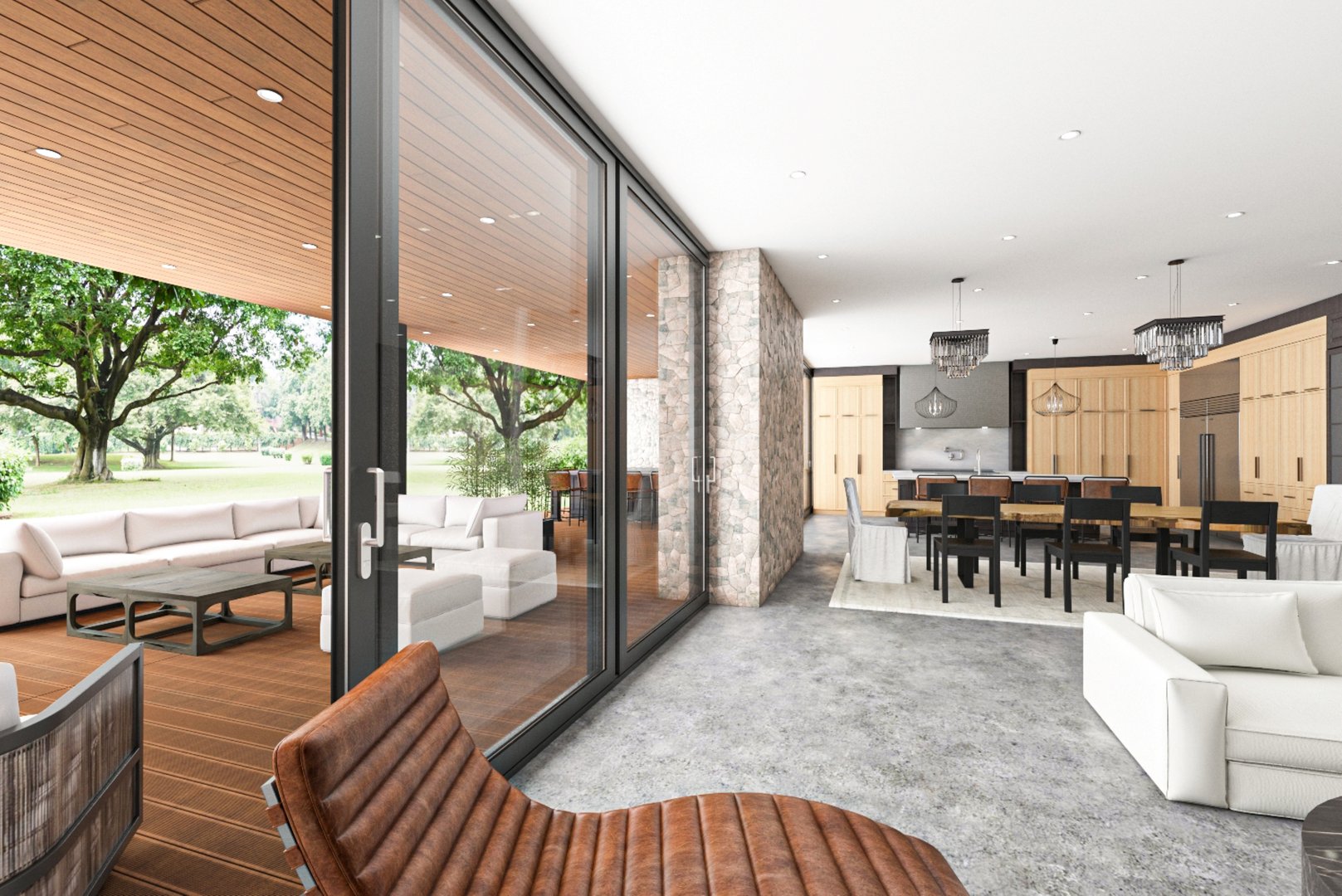 Elegant open-concept indoor space with seamless transition to a serene patio, showcasing comfortable furniture and natural elements for a blend of modern and outdoor living.