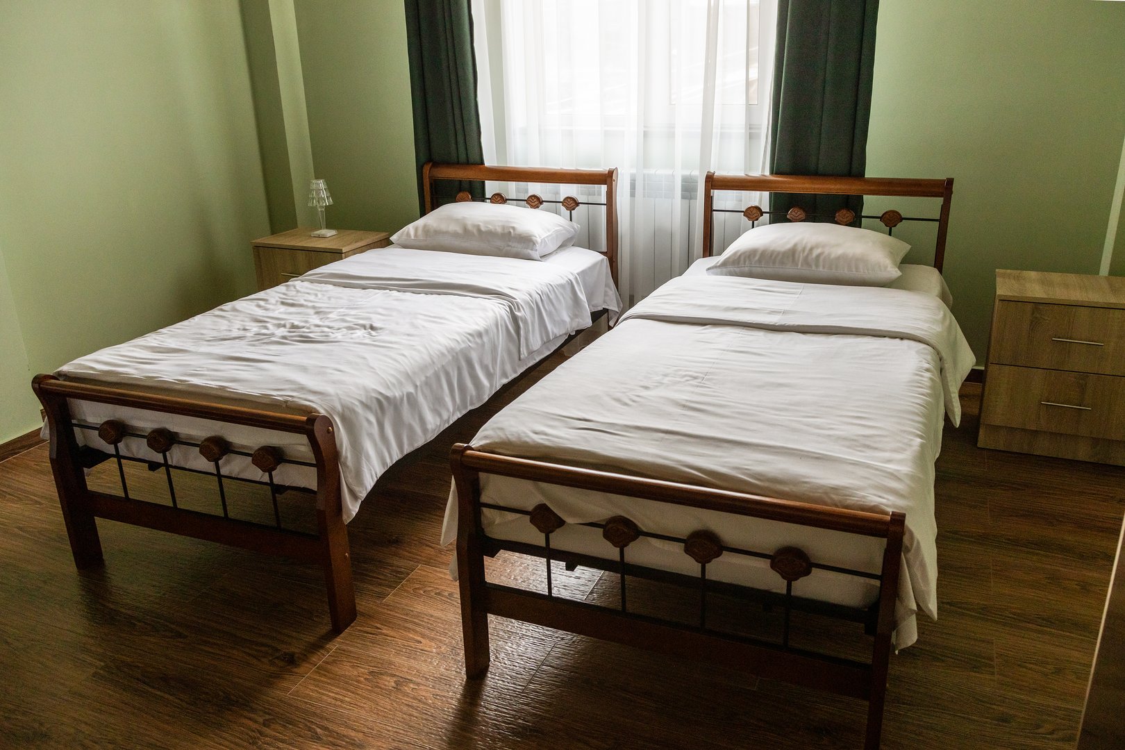green twin bedoom in local armenian guesthouse