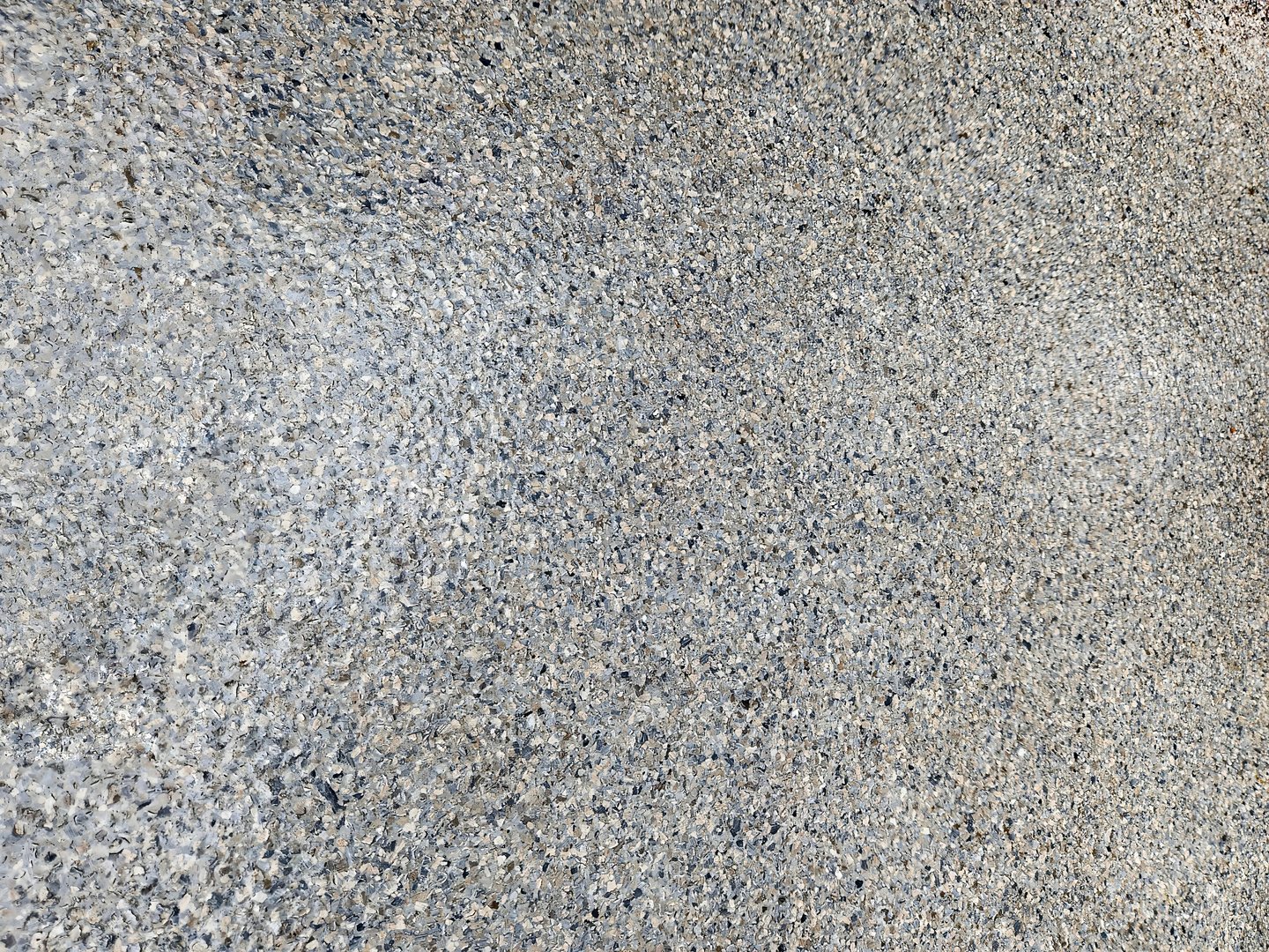 Flecks of plastic pieces in epoxy floor coating