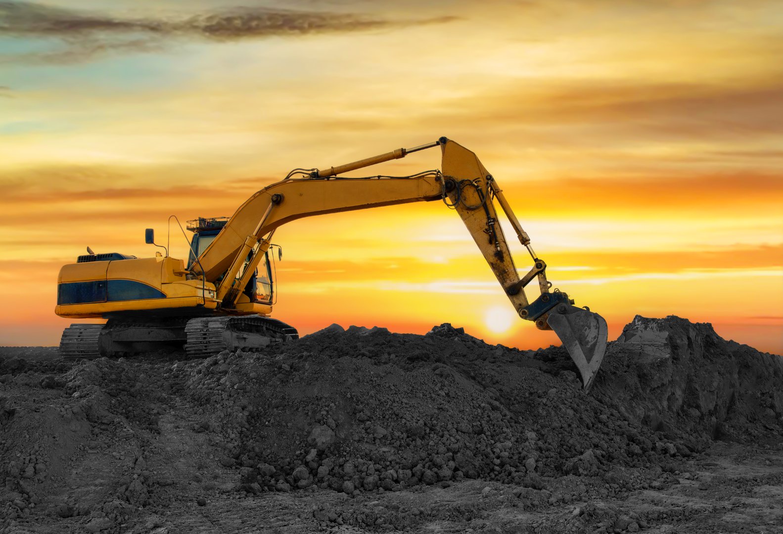 Coal mining in an open-pit. Excavator on Coal mining. Excavator digging in open pit coal mine. Excavator in open-pit on sunset background. Heavy machinery in opencast. Earthmover on earthmoving