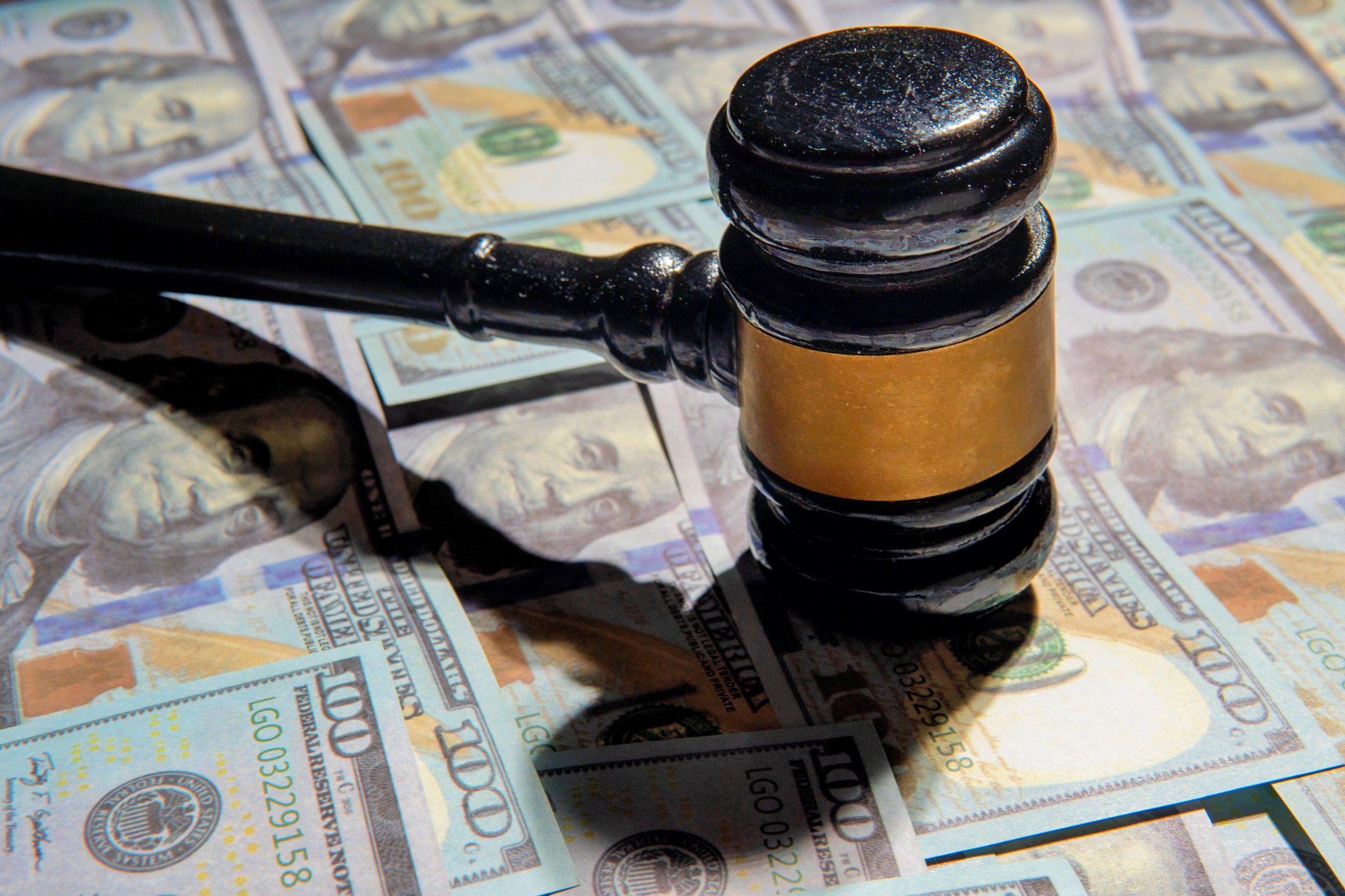 Closeup image of gavel and money. Fine, penalty, bribe concept.