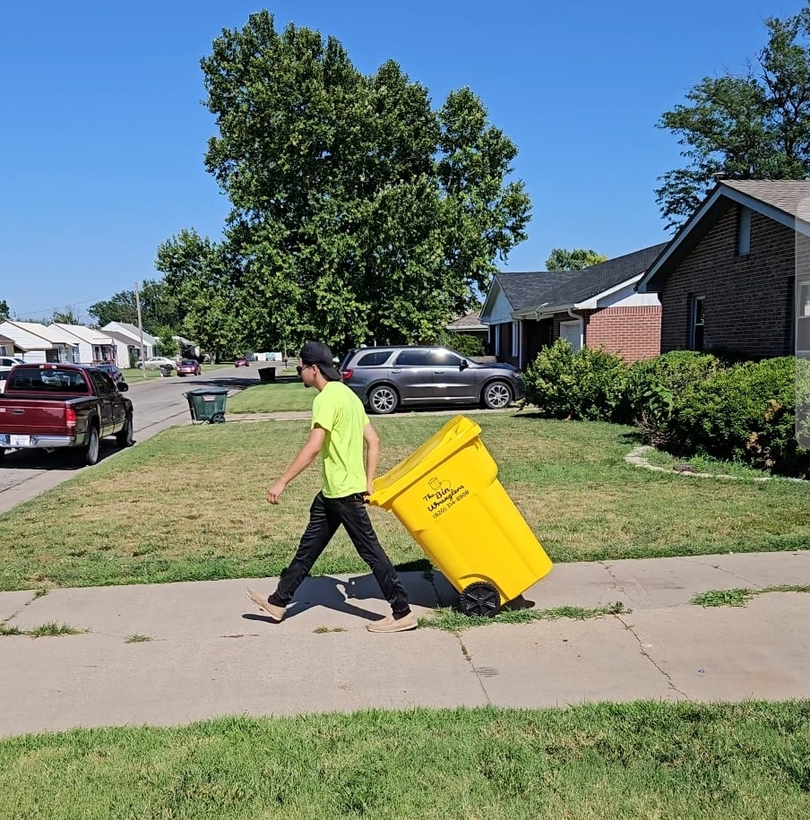 Customer moving trash bin