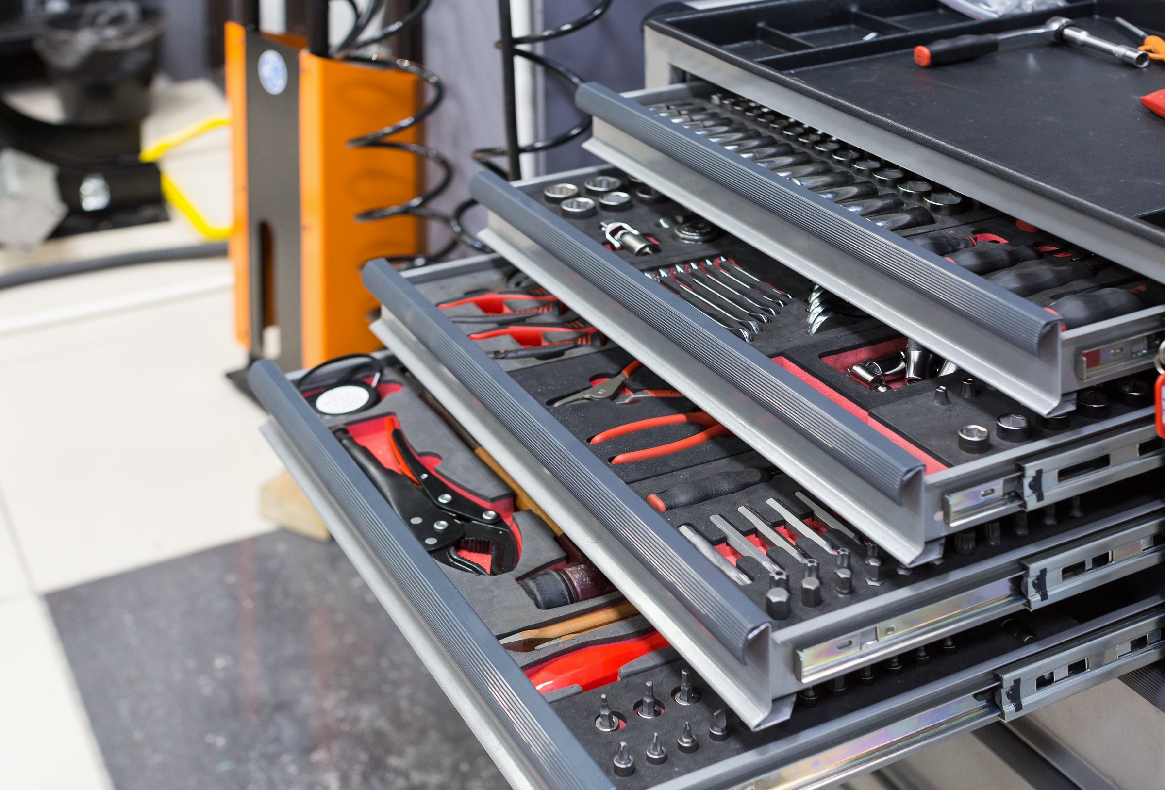 Pull-out shelves in a car service workshop. Close up photo.