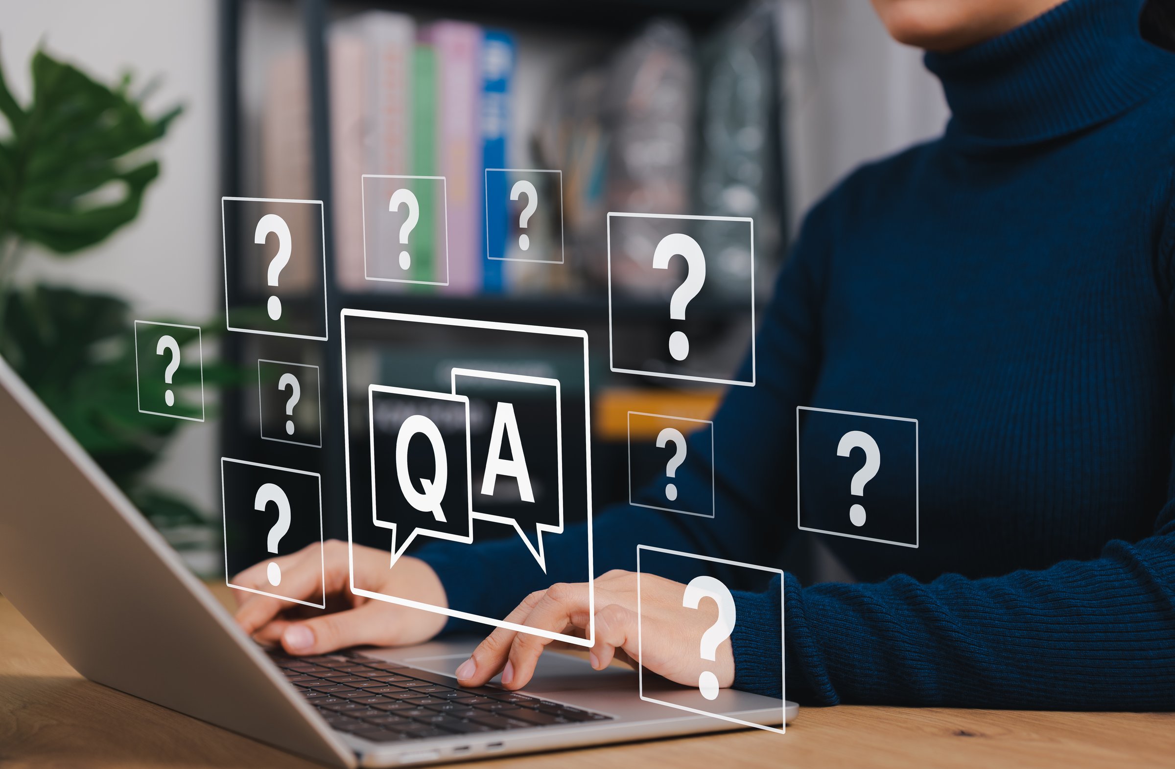 Q and A Support. Woman typing on laptop with Q&A and question mark icons. Concept of online customer support, FAQ system, knowledge base, digital consultation and automated question answering service.