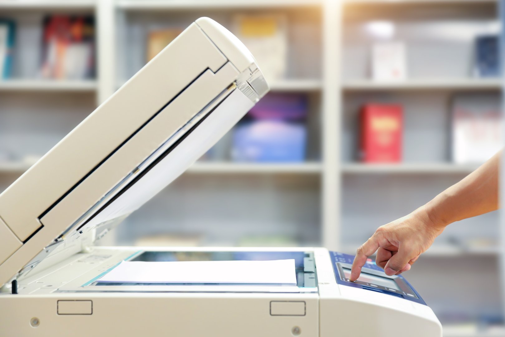 Businessman use photocopy or copier or photocopier in office workplace is equipment for copy duplicate Xerox or scanner to scanning document or printer for printing paper.
