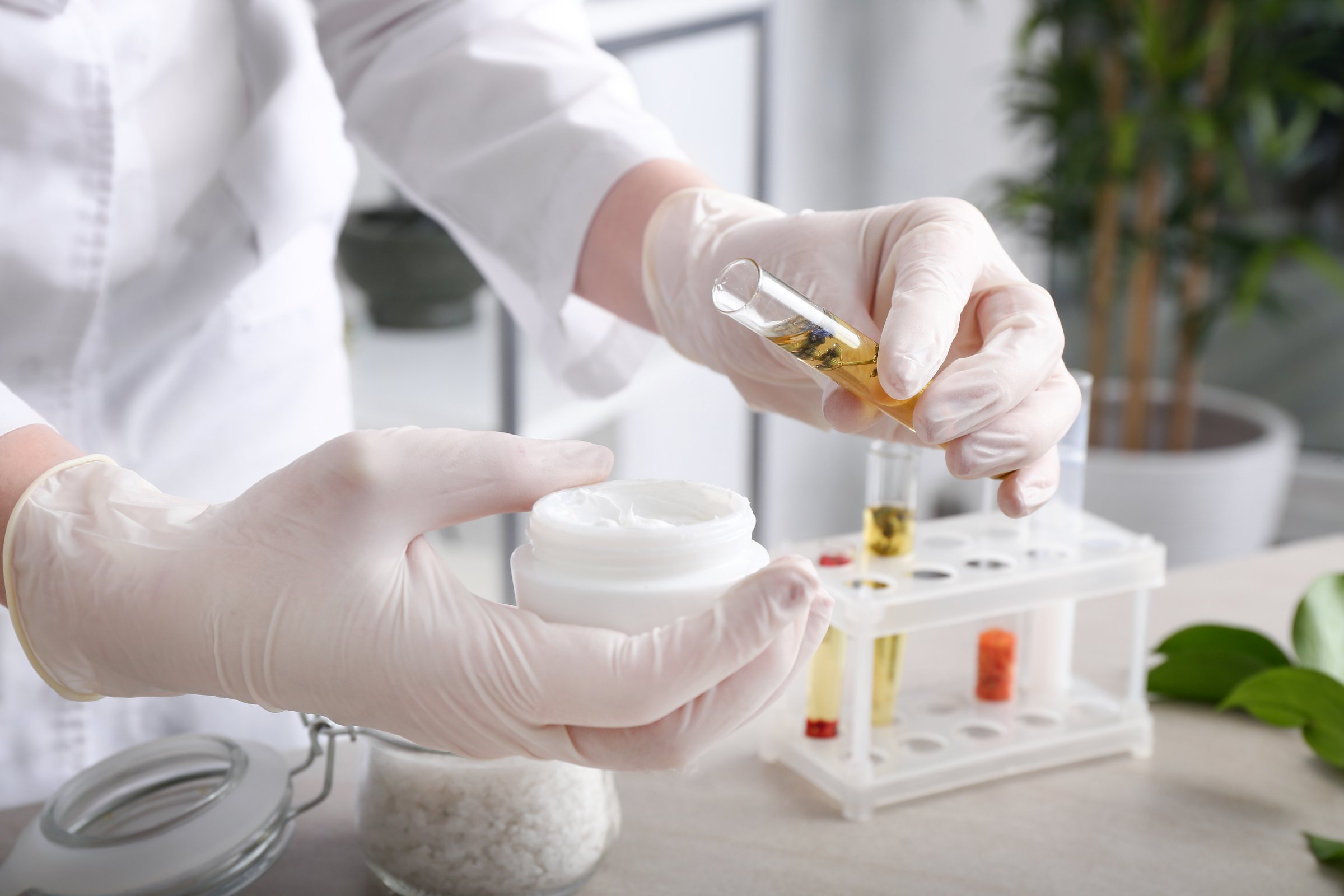 Beautician preparing natural cosmetics, closeup