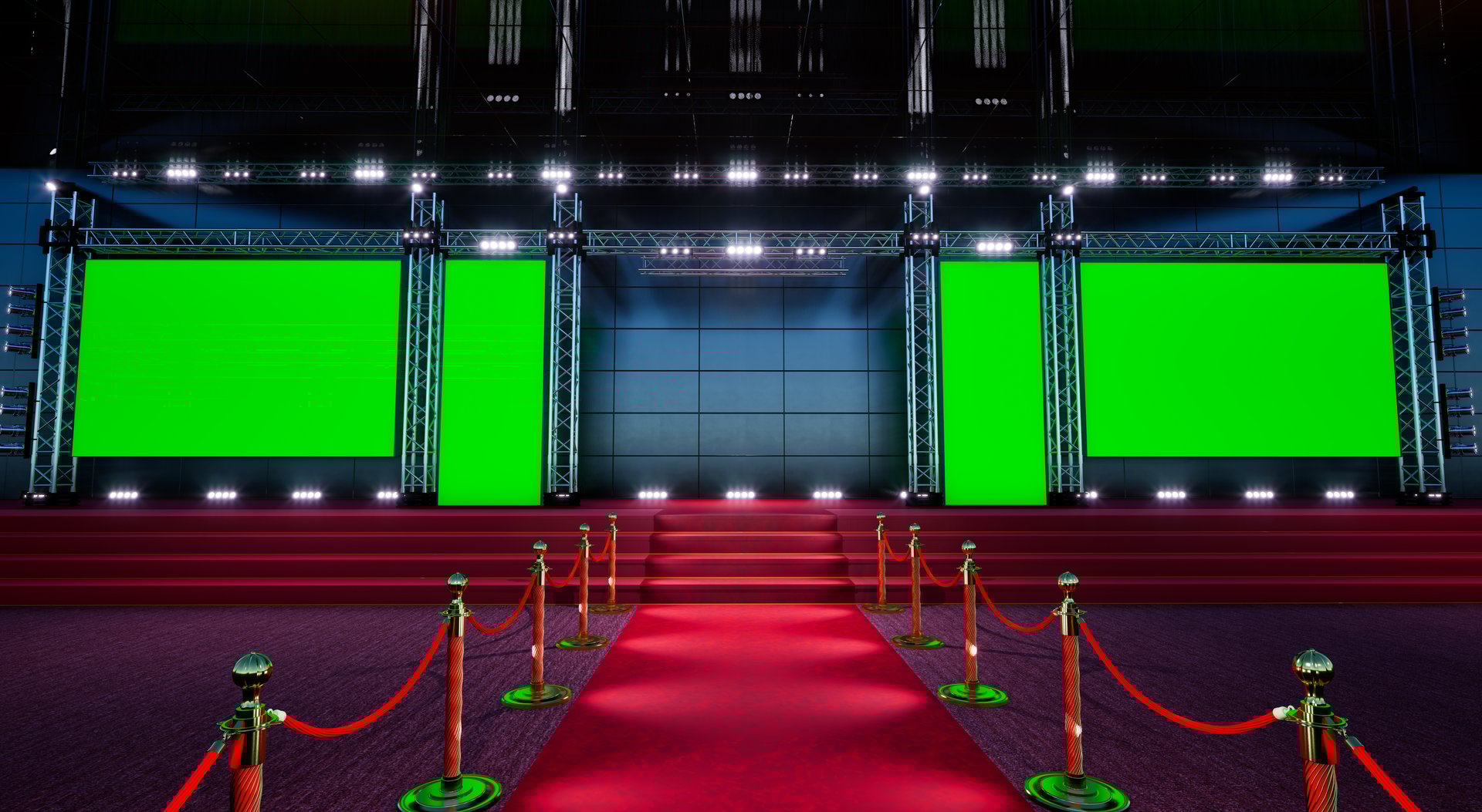 red carpet with golden barriers leading to a big green stage, emty stage