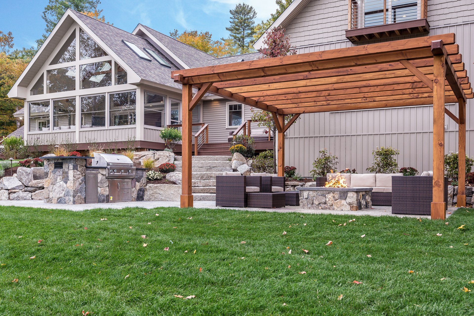 Hot tub, fire pit and patio furniture in a perfect setting for entertaining