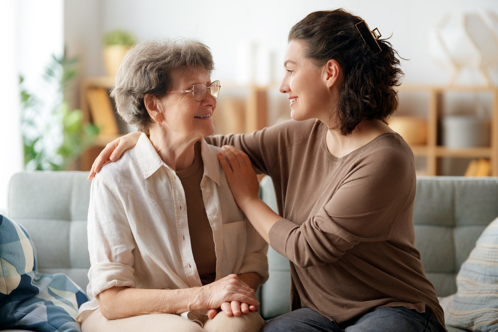 Happy patient and caregiver spending time together. Senior woman and her adult daughter.