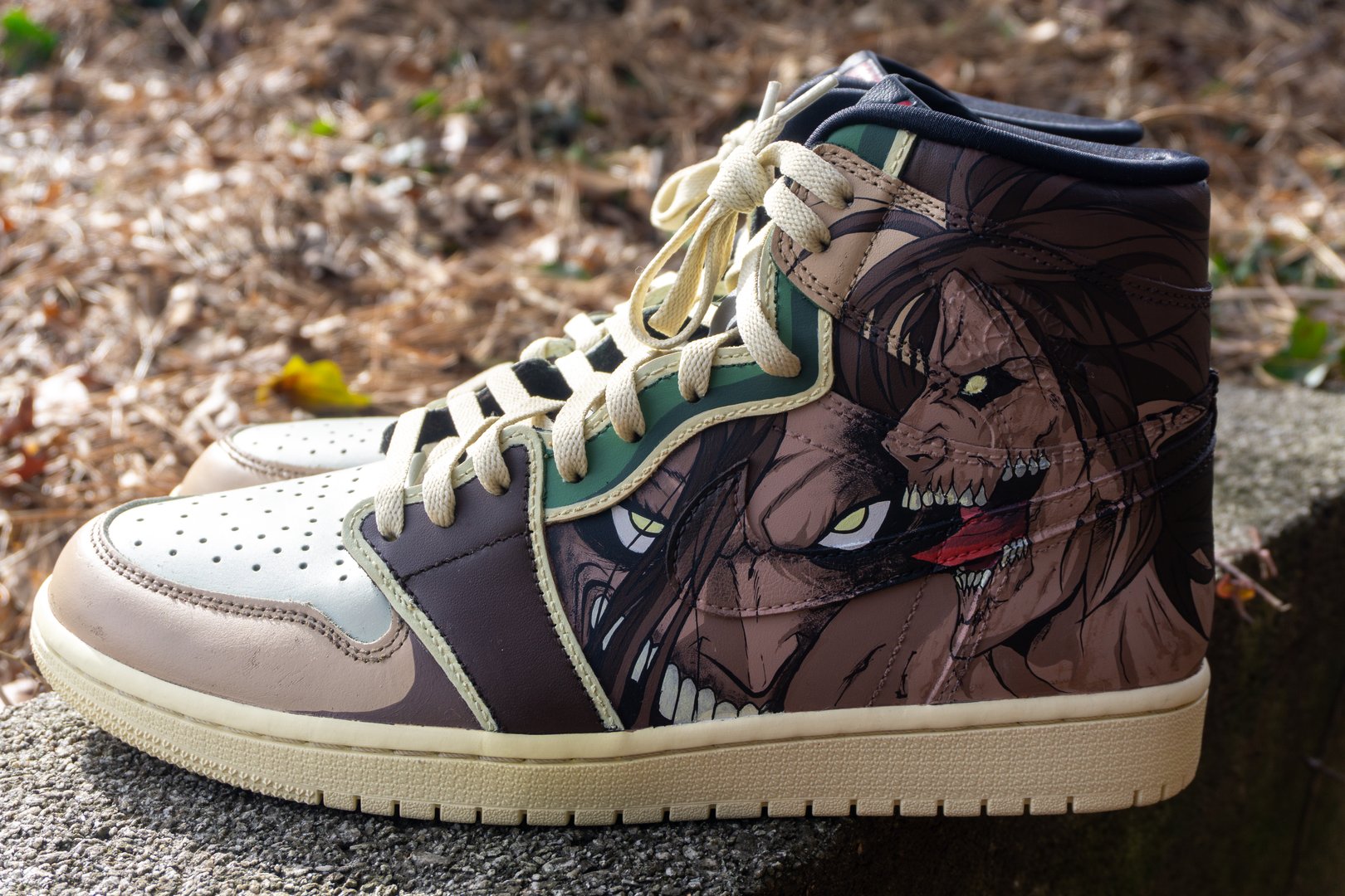 Custom high-top sneakers with anime character artwork, featuring intense facial expressions and beige laces.