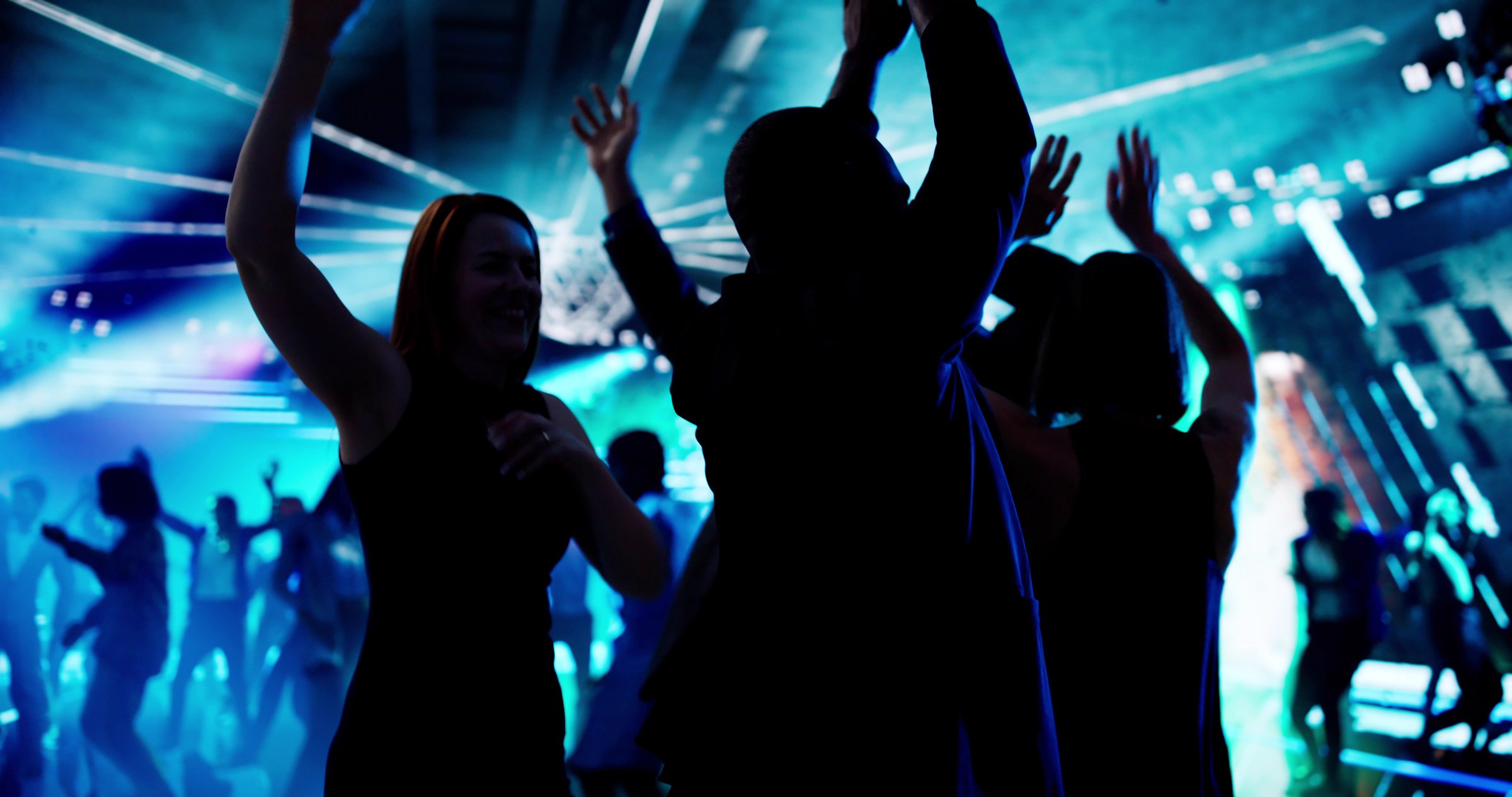 Nightclub DJ Spinning Beats, Crowd Dancing In Silhouette Motion
