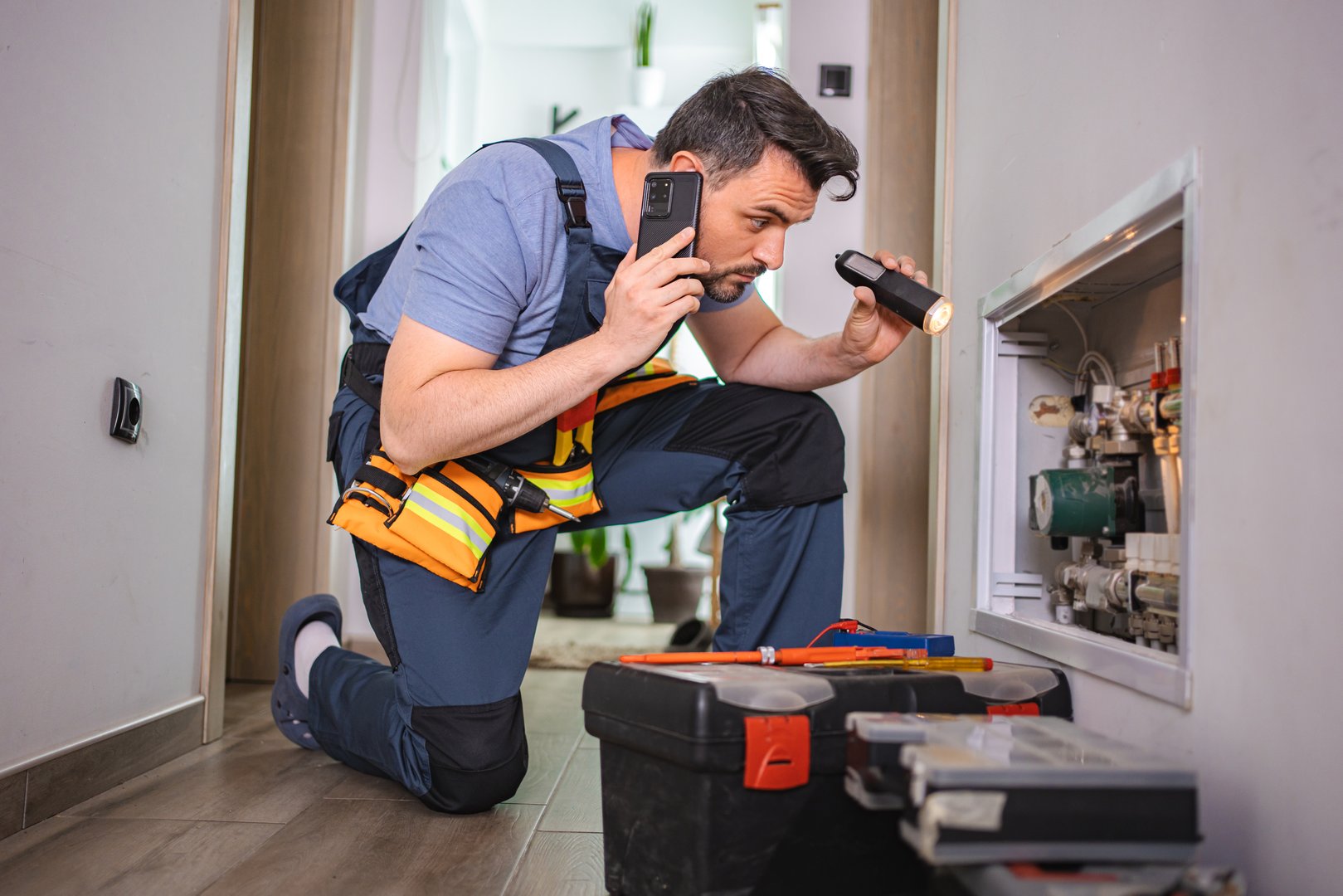 Technician inspecting heating