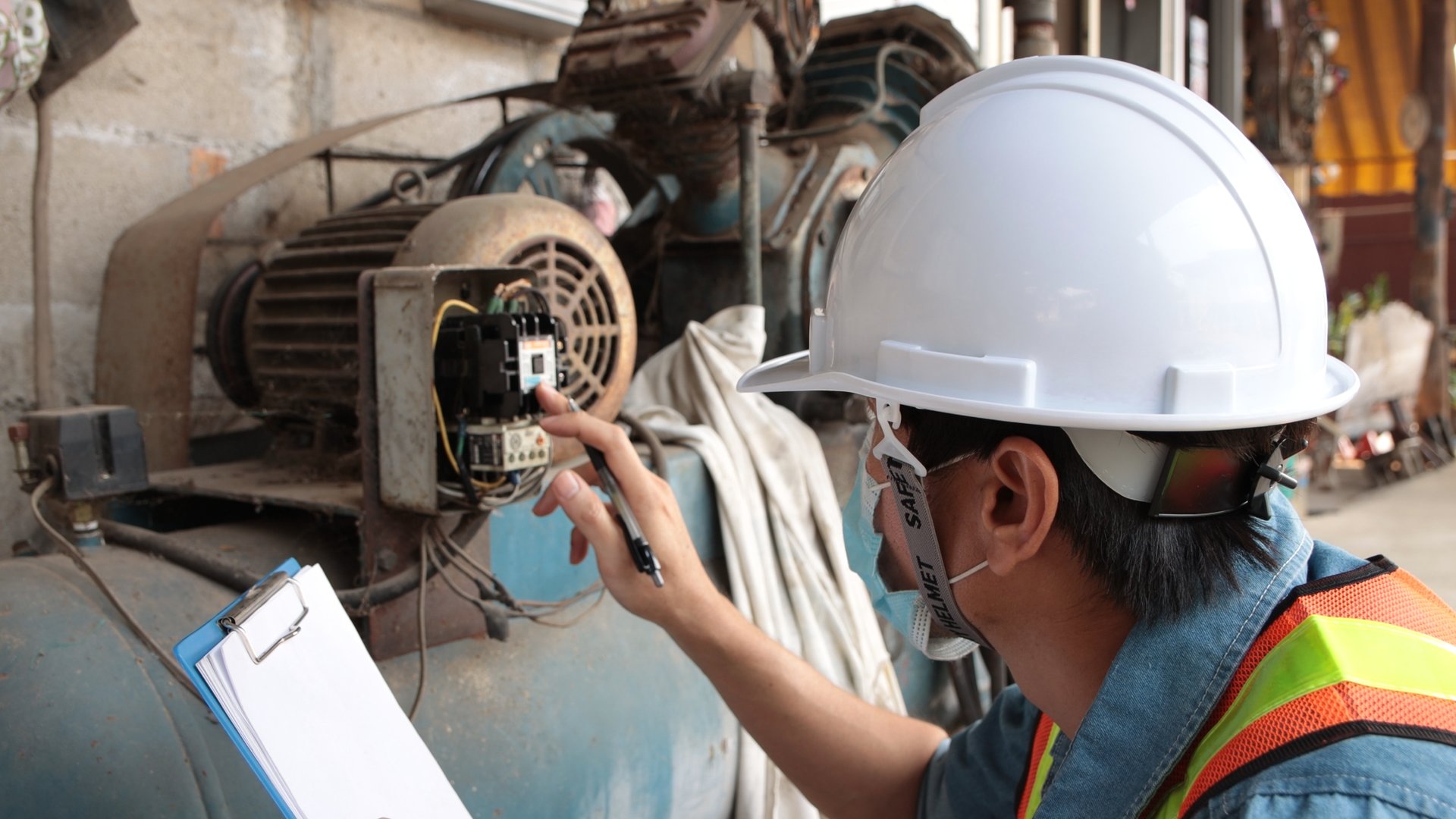 Mechanical Engineering Check and Record Magnetic Contactor Data of Air Compressor in Factory. Professional Occupation Working in Factory or Plant