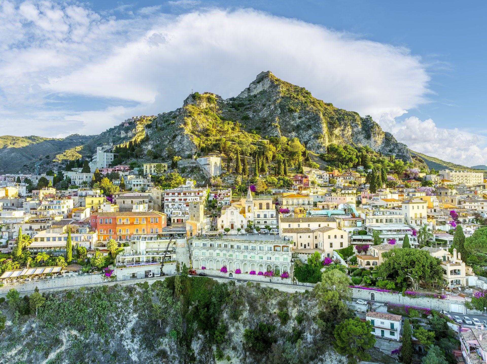 Landscape with Taormina, Sicily, showcasing the picturesque hillside village and Mediterranean scenery.