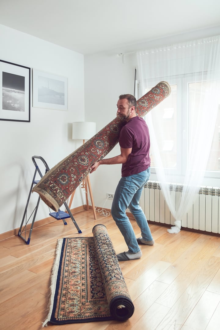 Professional rug cleaning pickup service in an Atlanta home