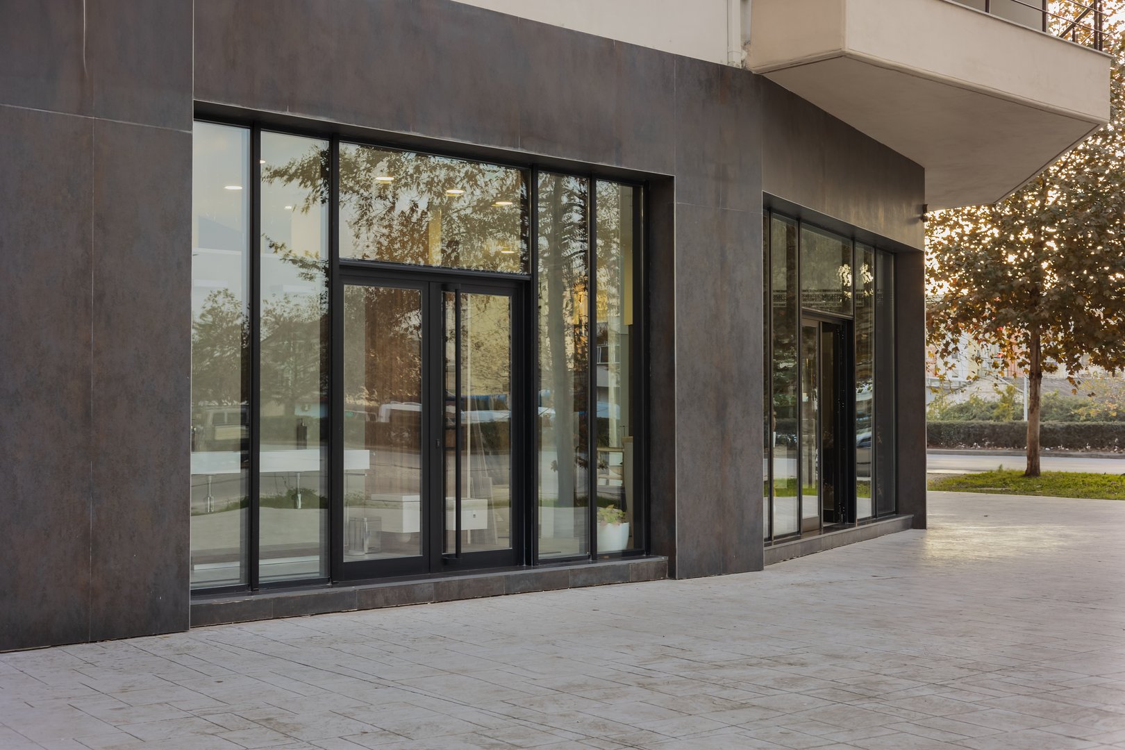 Photo of the mall shopping street in Europe. Exterior of a new shopping center building. Mall complex outdoor. Modern design. Nobody, street photo
