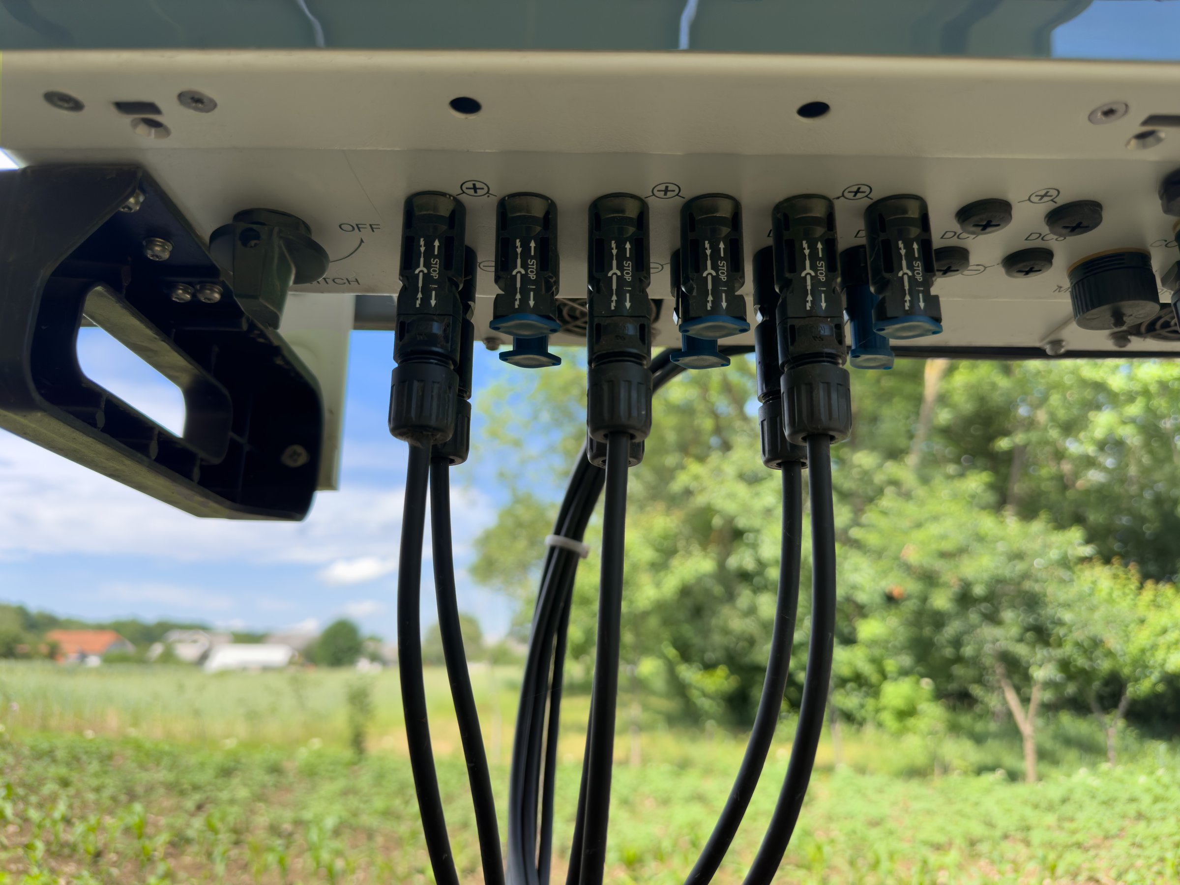 Input of cables to the solar inverter. Connecting the cables to the solar inverter. Solar inverter hybrid isometric system controller with switch. Connecting the hybrid inverter to the panels