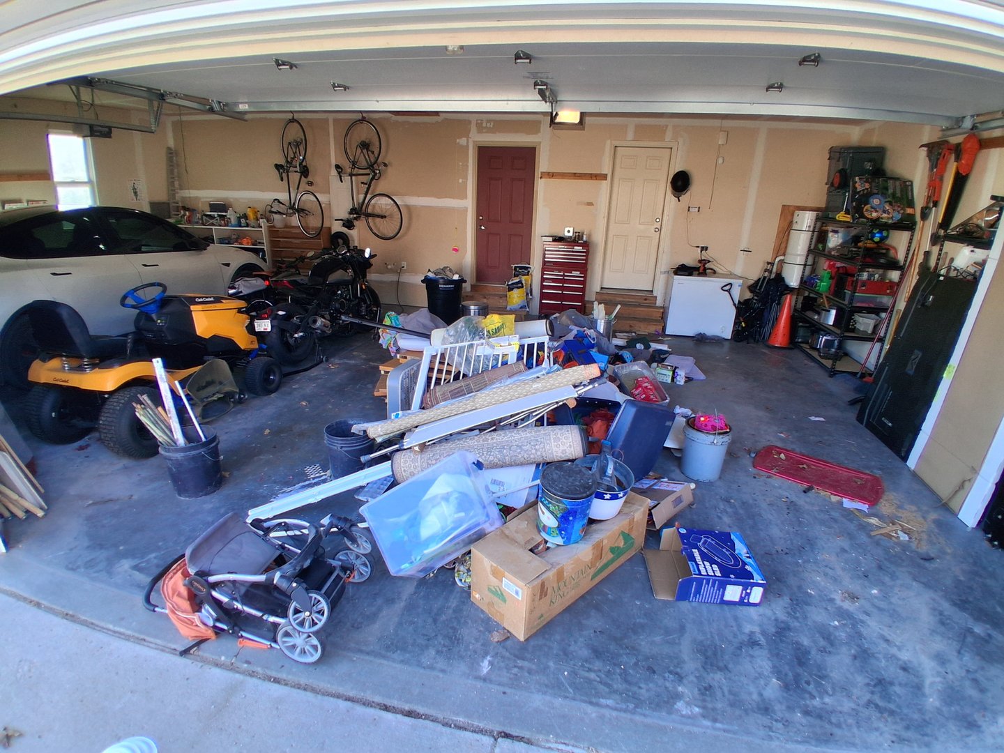 Before junk removal - cluttered garage