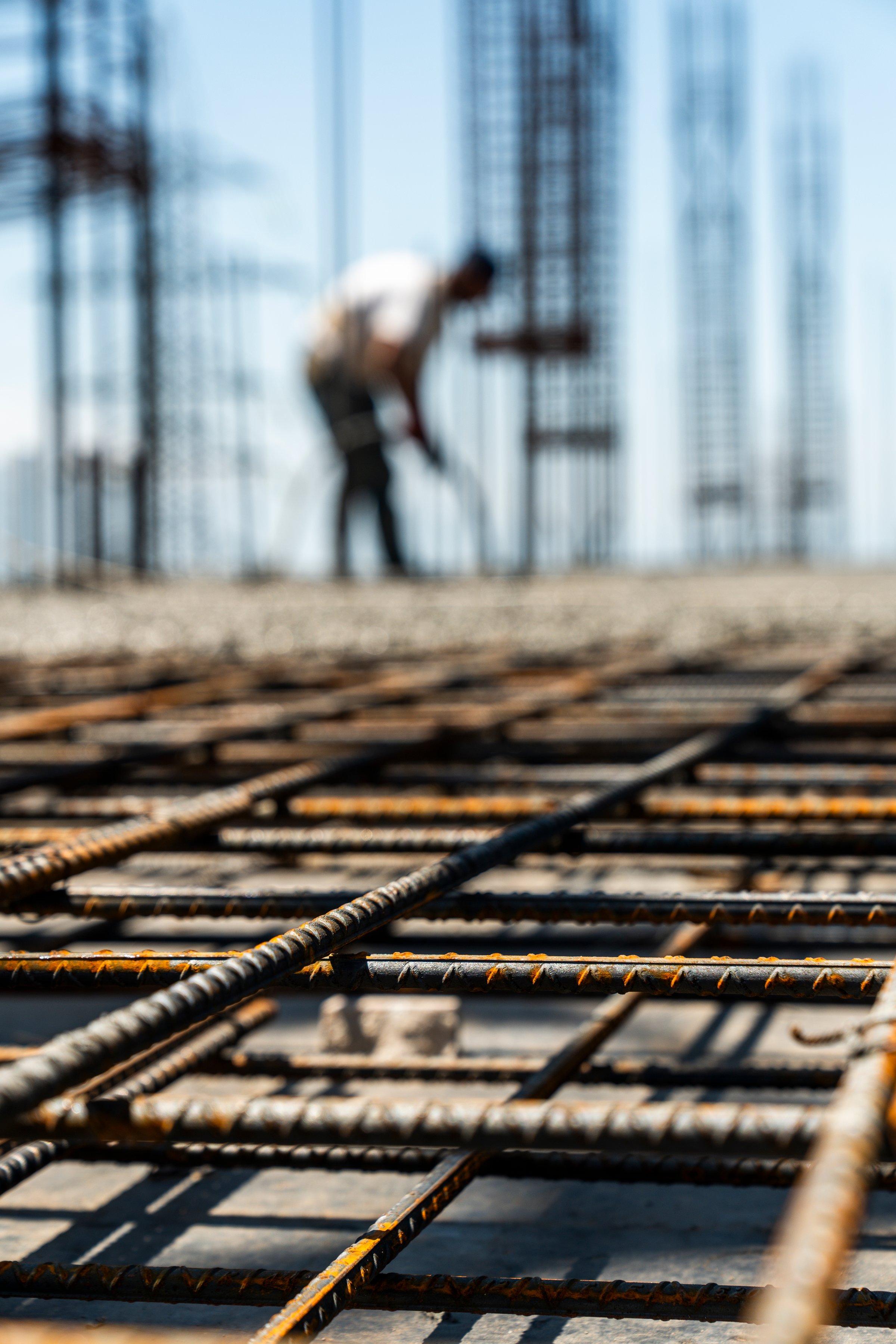 Iron grate or reinforcement on the ground poured with concrete at a construction site