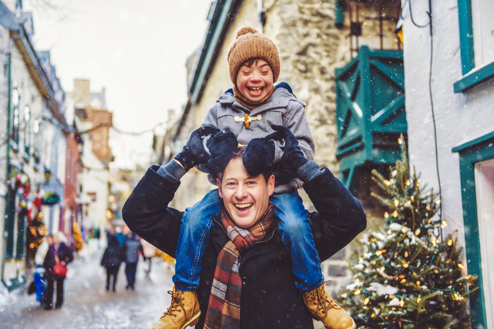 A Father with little son having fun together outdoor on frosty day