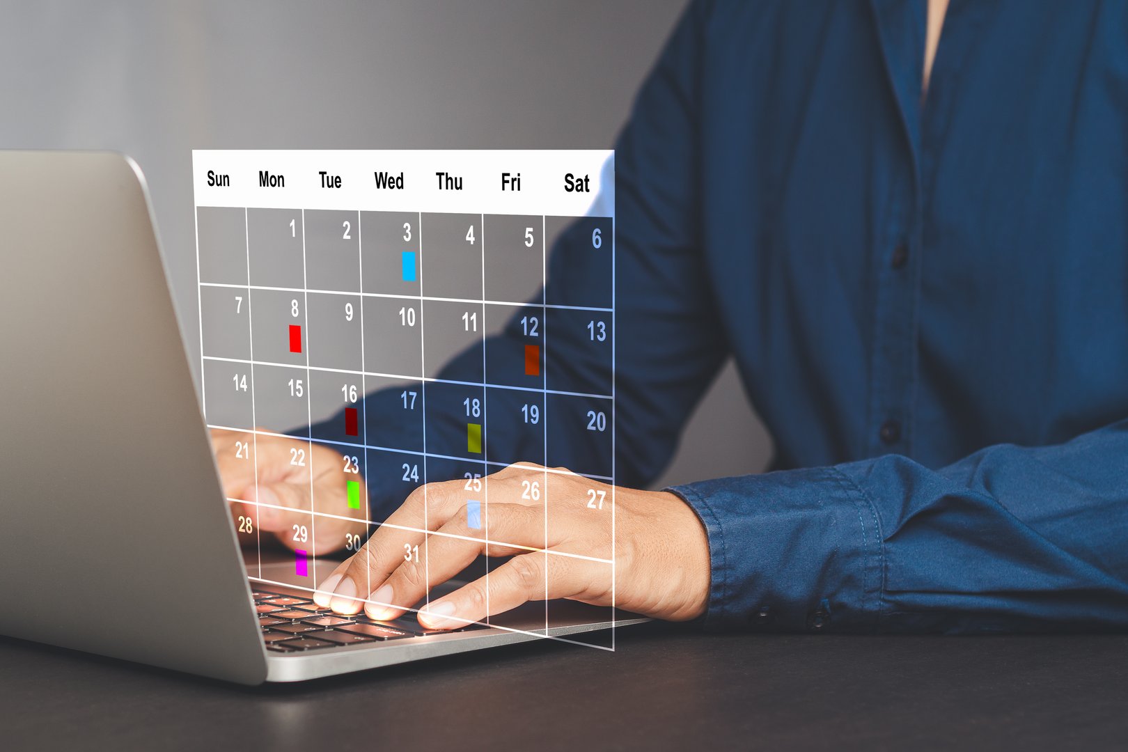 Efficient time management. A businesswoman in a navy blue shirt is planning on a digital calendar and effective task management. Concepts of business and strategy