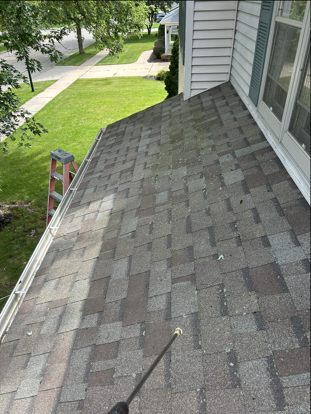 Roof before cleaning showing dirt and debris