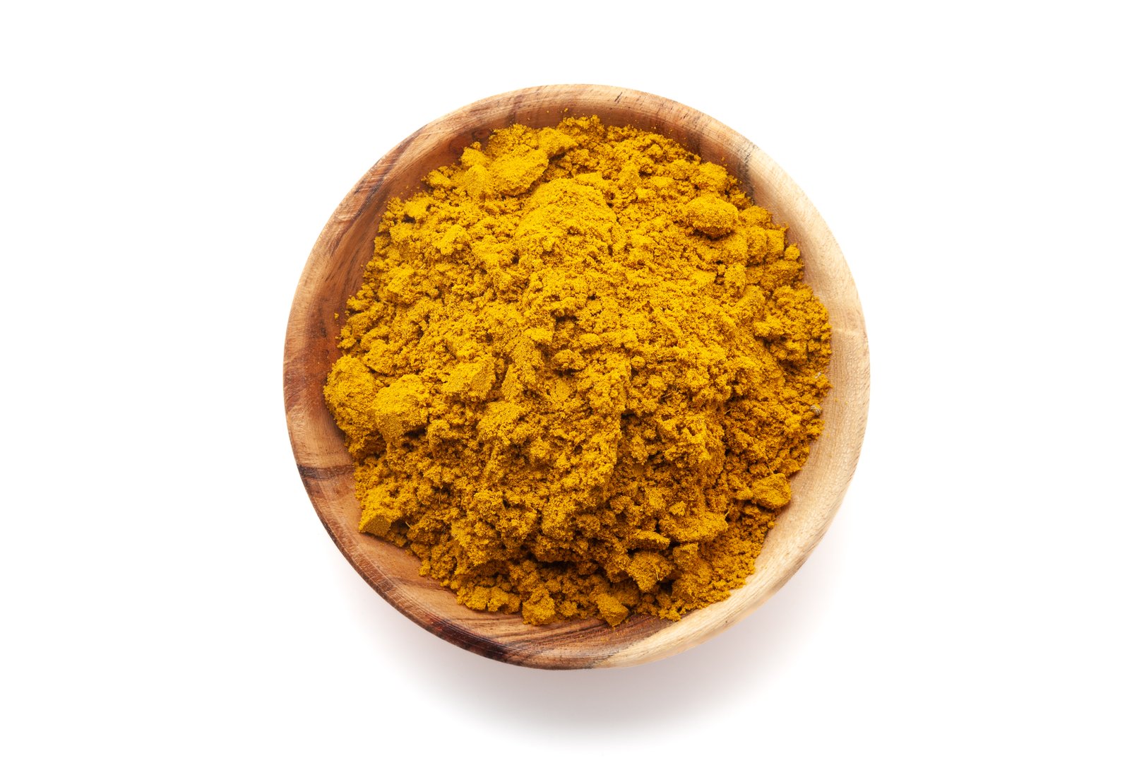 Top View of Organic digestive powder called "Buknu" a mixture of Indian ayurvedic herbs and spices, in a wooden bowl. Isolated on a white background.