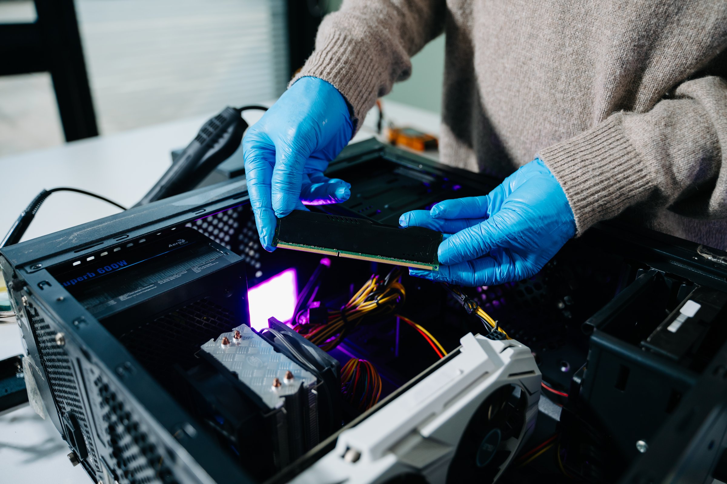 Electronics assembly and RAM installation with high-tech components. Ideal for showcasing advanced technology and computer engineering concepts