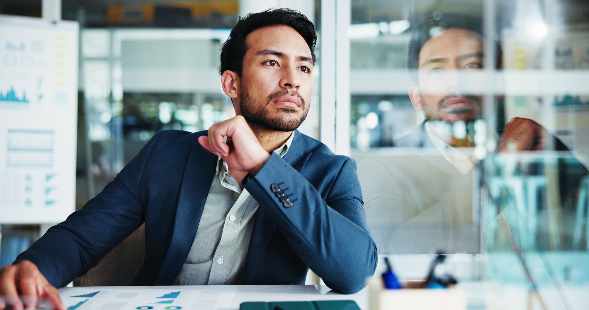 Man, thinking and finance at office with decision for budget, solution and review by glass. Person, charts and perspective with reflection for graphs, problem solving or choice at accounting agency