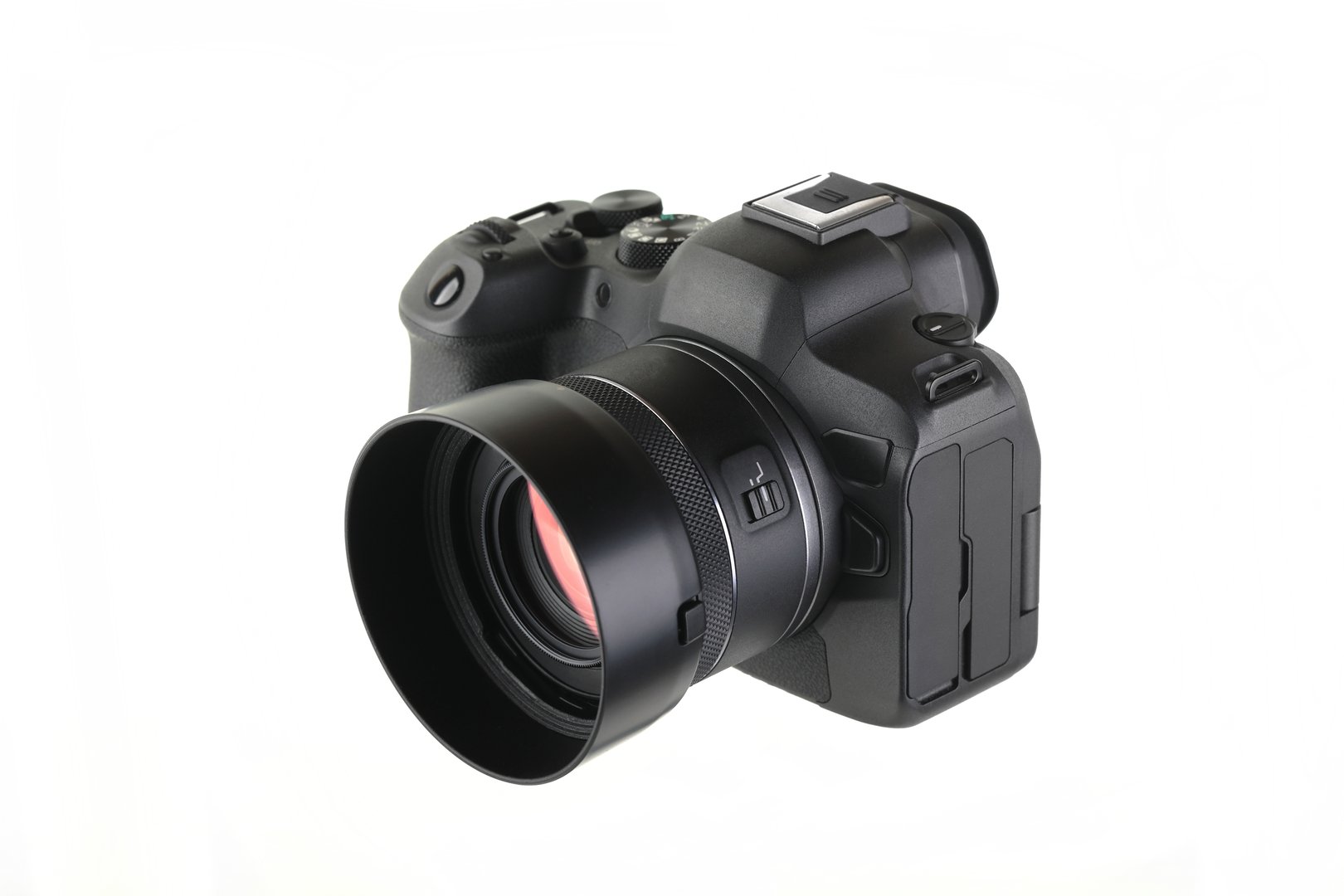 Modern digital mirrorless camera with Lens on a white background.