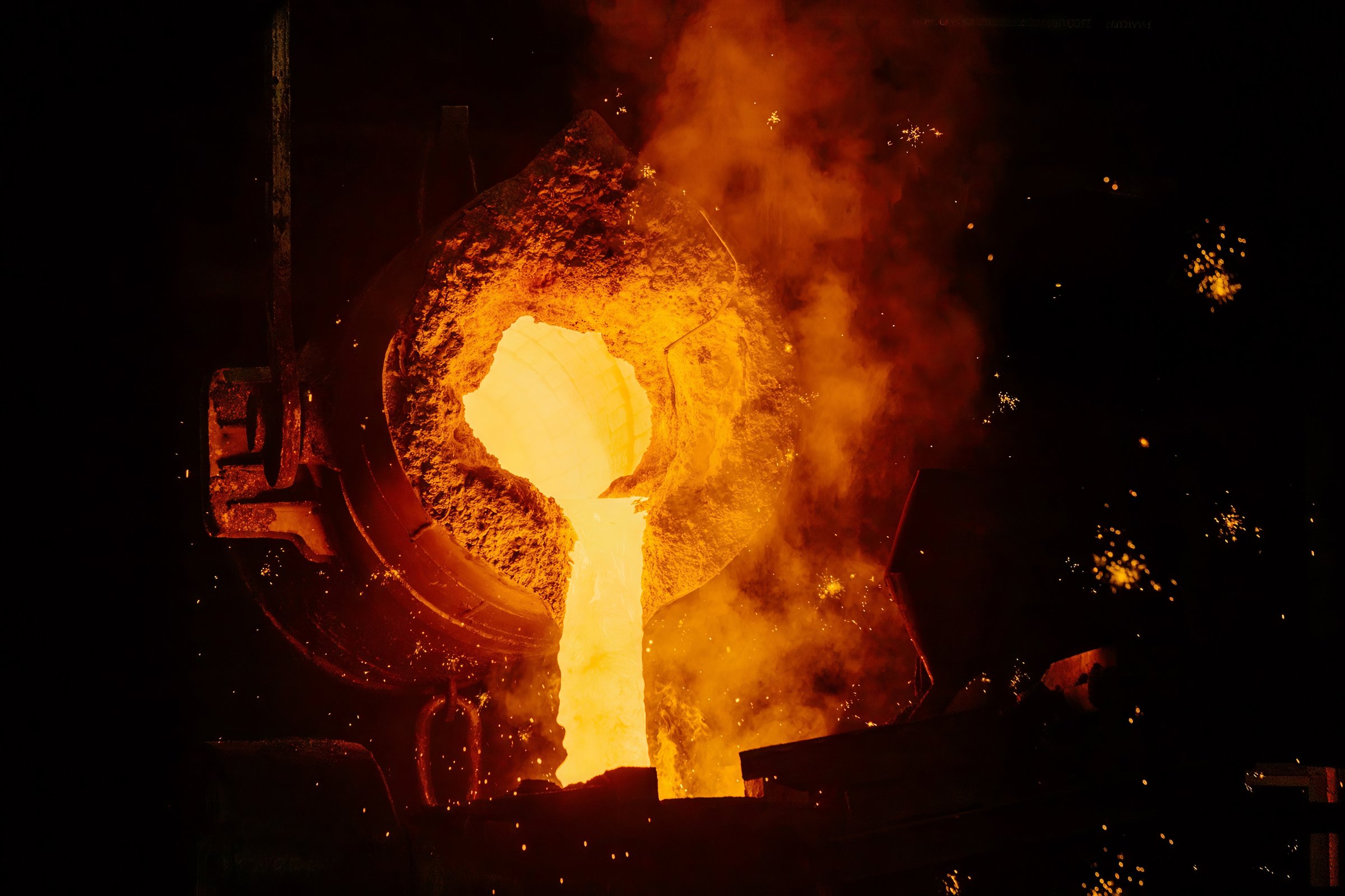 Metal casting process in metallurgical plant. Liquid metal pouring into molds.